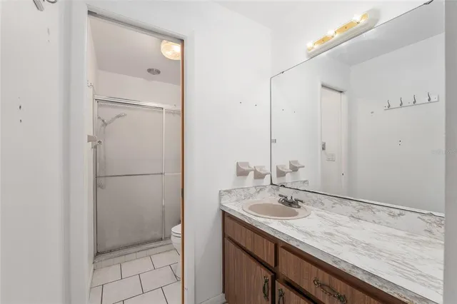 a bathroom with a shower and a toilet