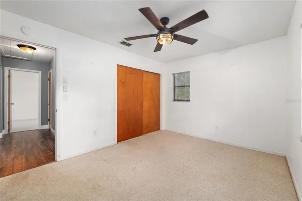 a room with pool table and windows