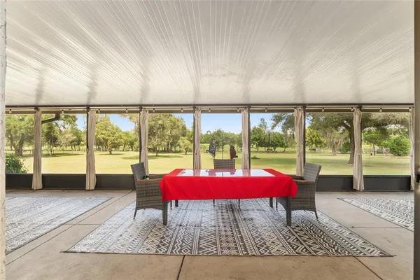 a outdoor space with balcony and glass door
