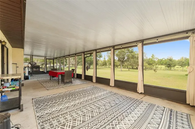 a view of a swimming pool with an outdoor seating