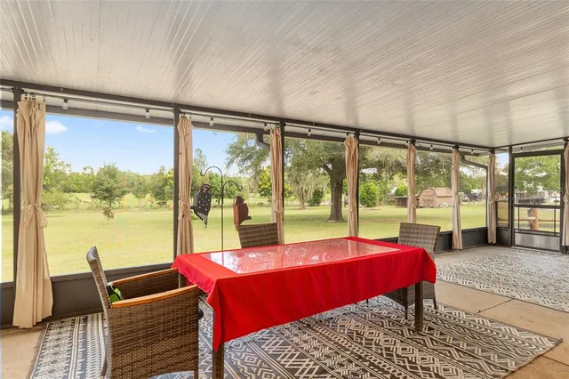 a view of a house with a yard and garage