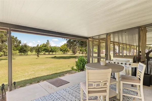 a view of a garage with a table and chairs
