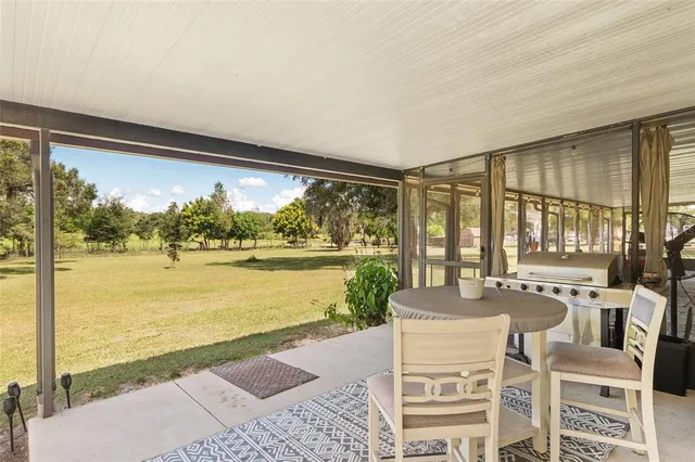 a view of a garage with a table and chairs