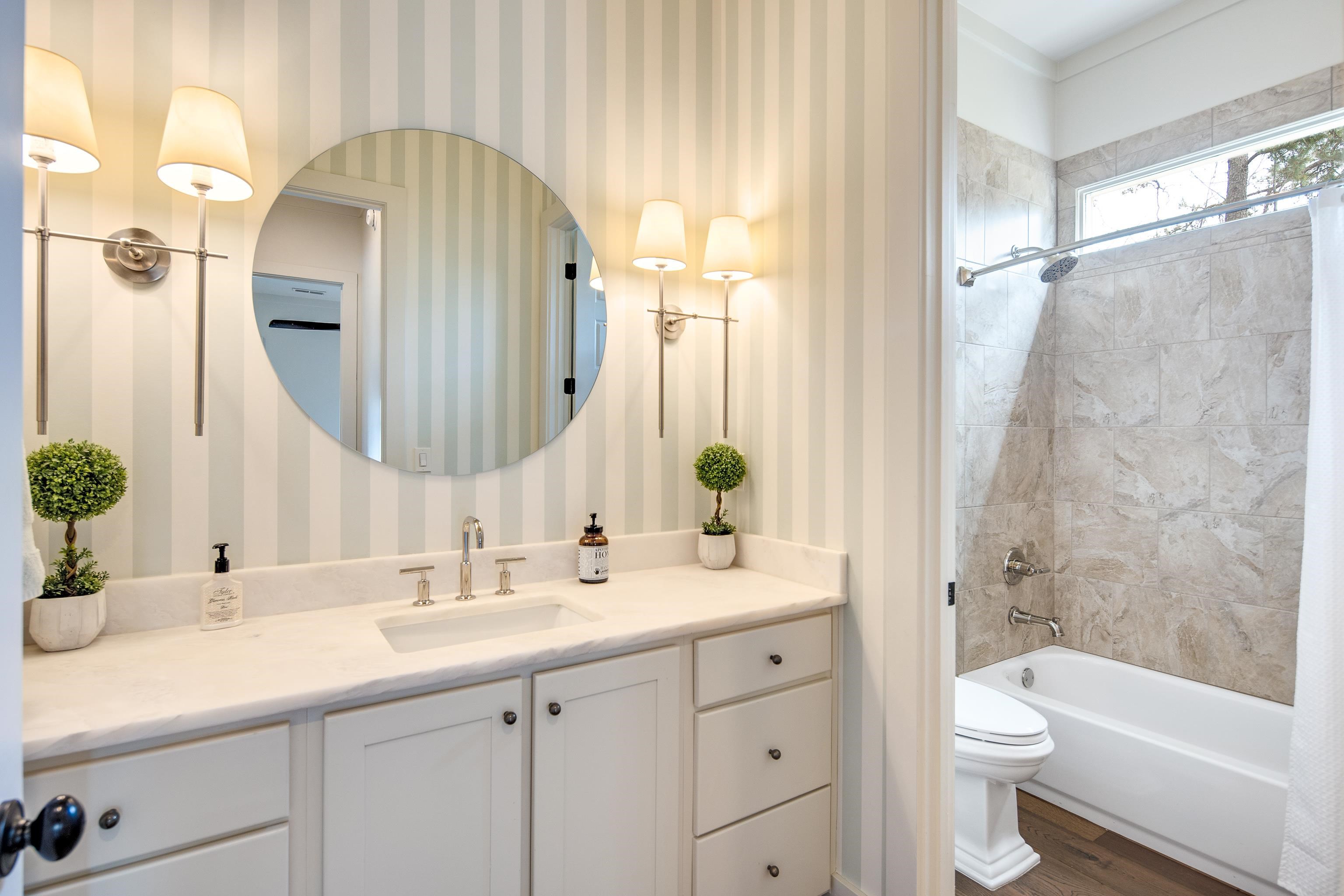 1480 Frank Road Collierville, TN 38017 - Photo 17 of 39 a bathroom with a double vanity sink toilet and shower