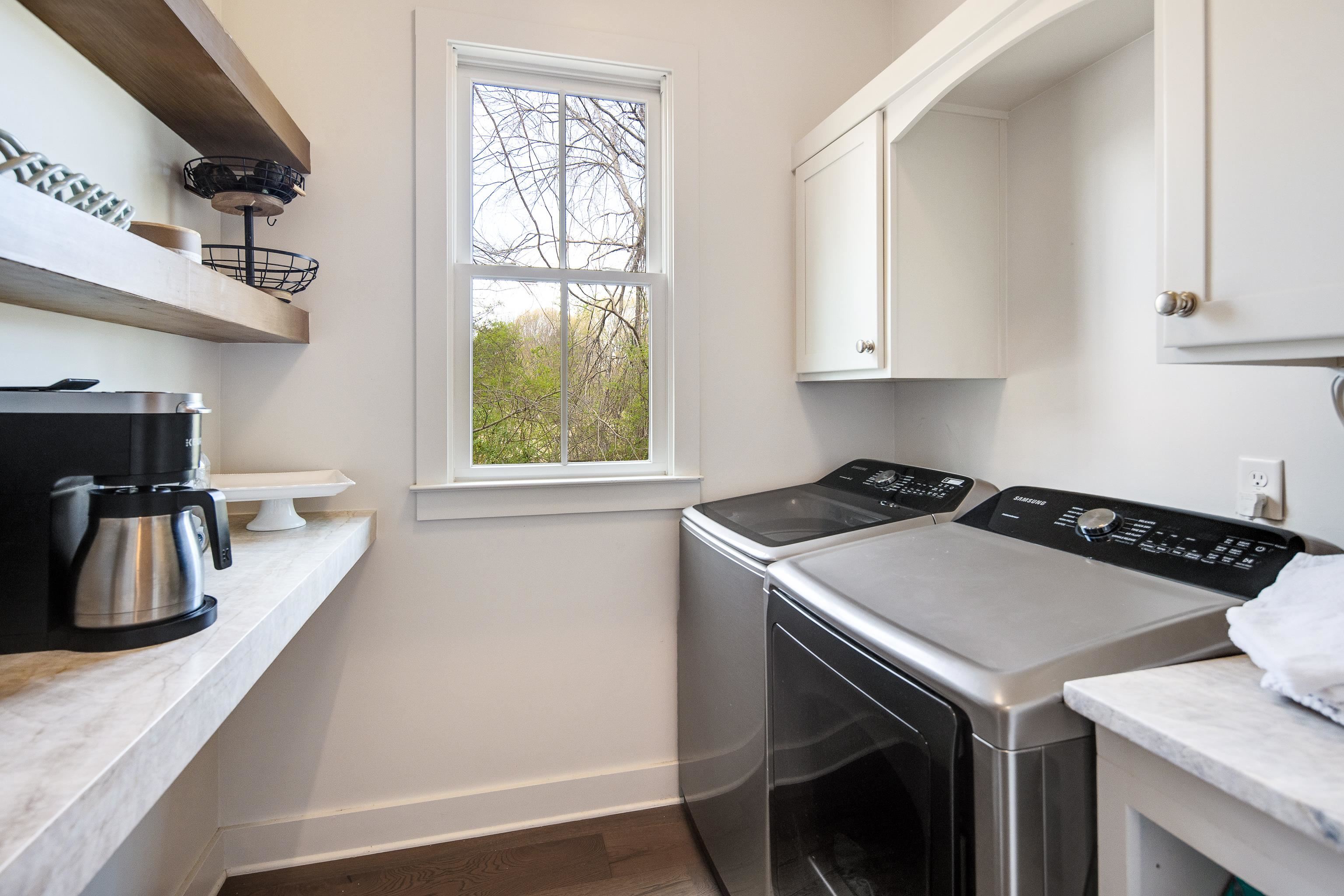 1480 Frank Road Collierville, TN 38017 - Photo 18 of 39 a kitchen that has a sink a stove and a window