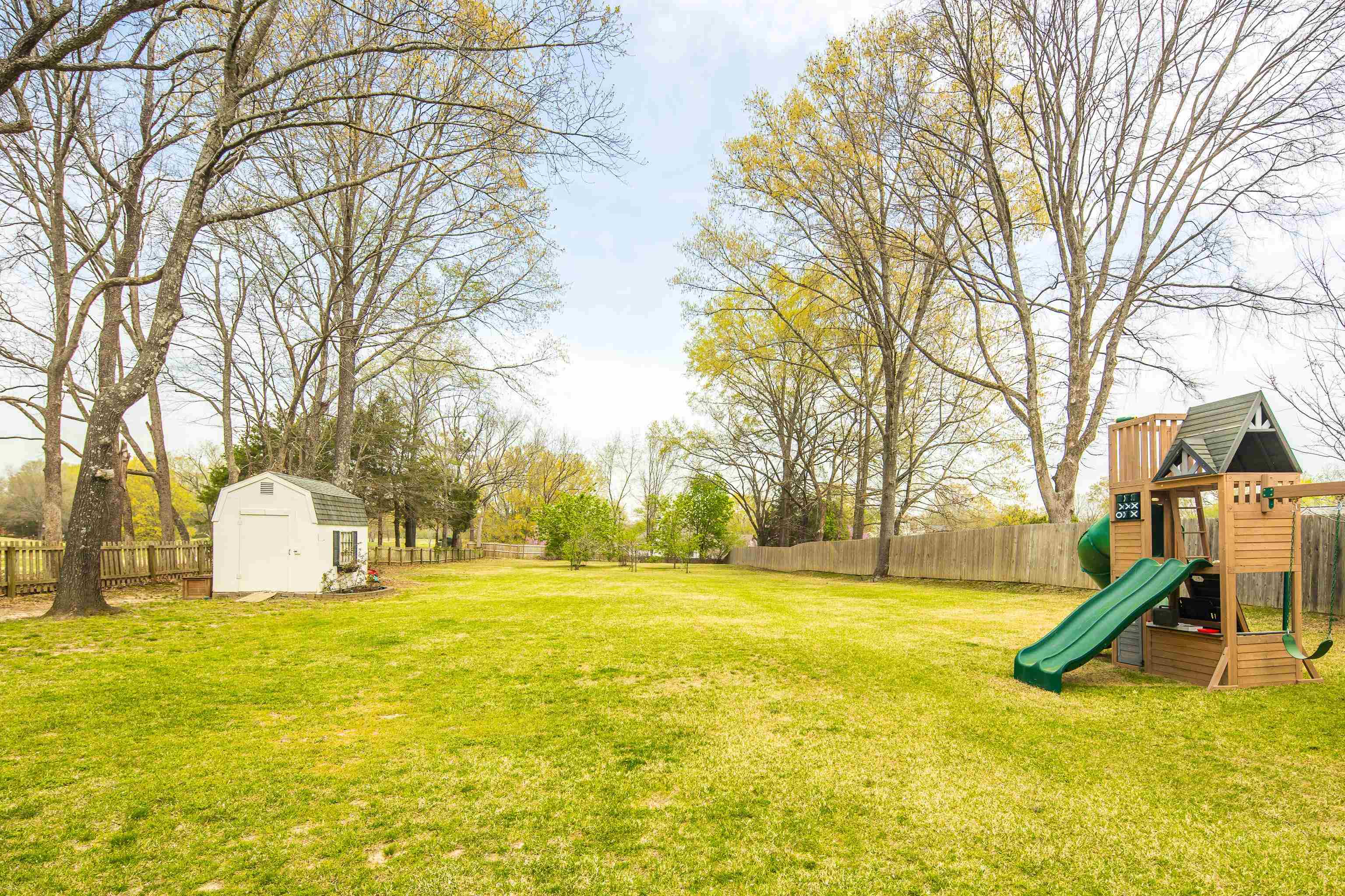 1480 Frank Road Collierville, TN 38017 - Photo 38 of 39 a view of a house with swimming pool and a tree