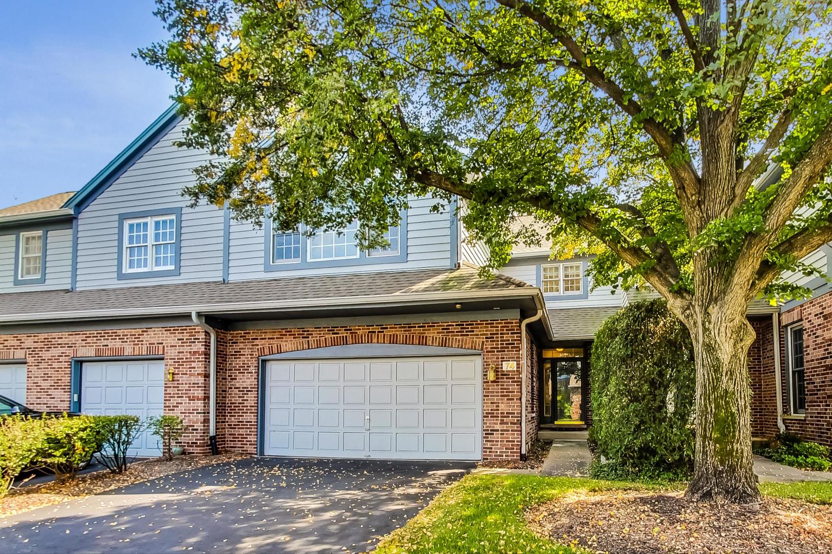 74 Trent Court Burr Ridge, IL 60527 - Photo 1 of 30 a front view of a house with a garden