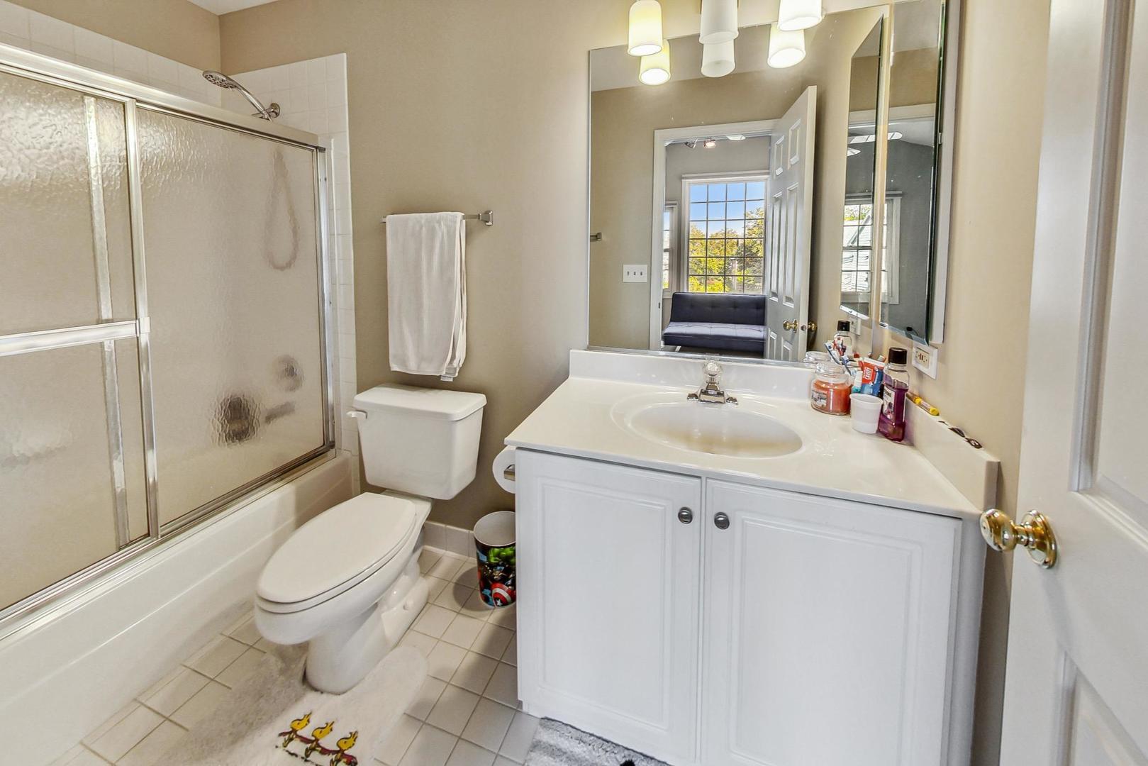 74 Trent Court Burr Ridge, IL 60527 - Photo 18 of 30 a bathroom with a sink toilet and shower
