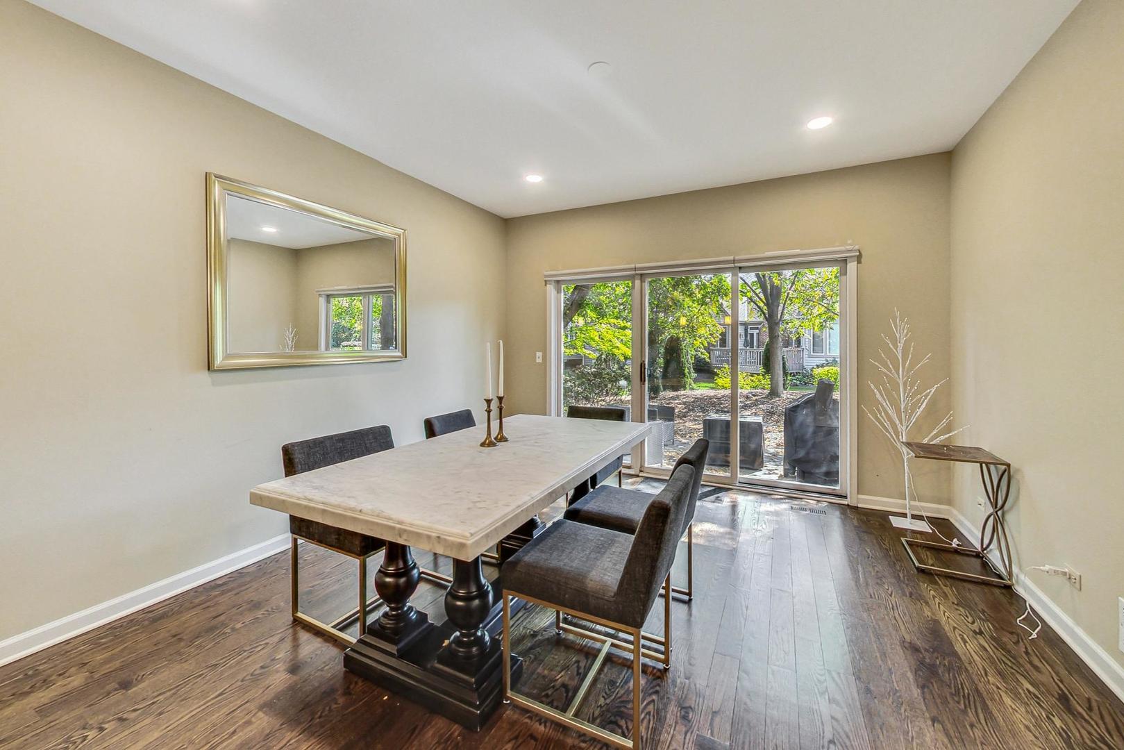 74 Trent Court Burr Ridge, IL 60527 - Photo 6 of 30 a view of a dining room with furniture a chandelier and wooden floor