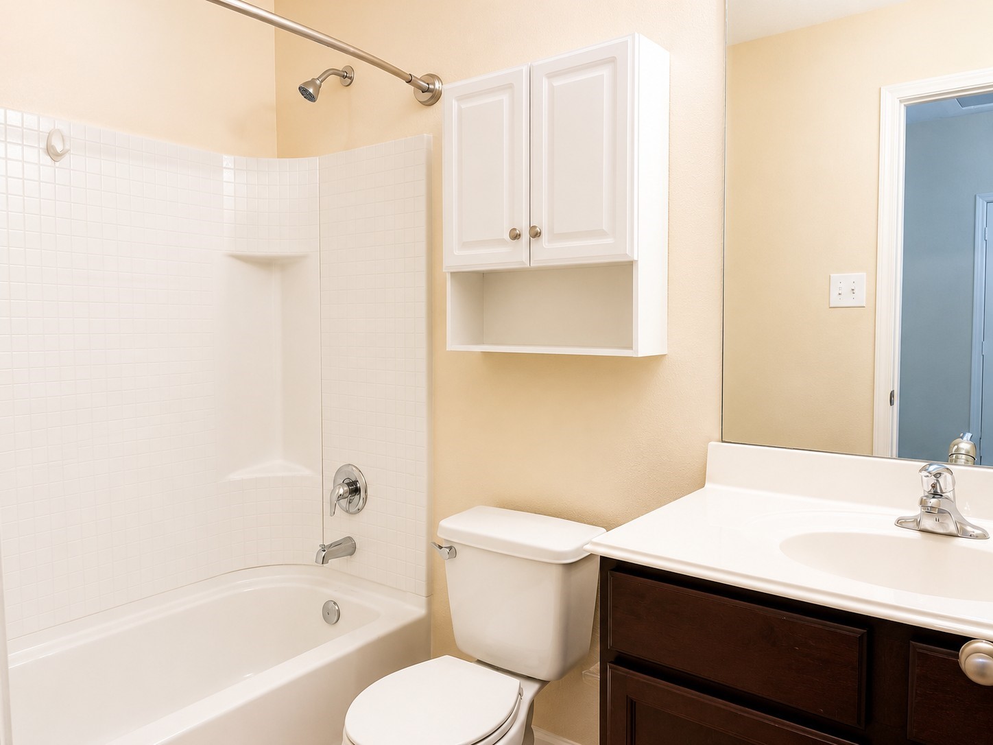 7599 Fettle Lane Conroe, TX 77304 - Photo 11 of 15 a bathroom with a sink toilet vanity and shower