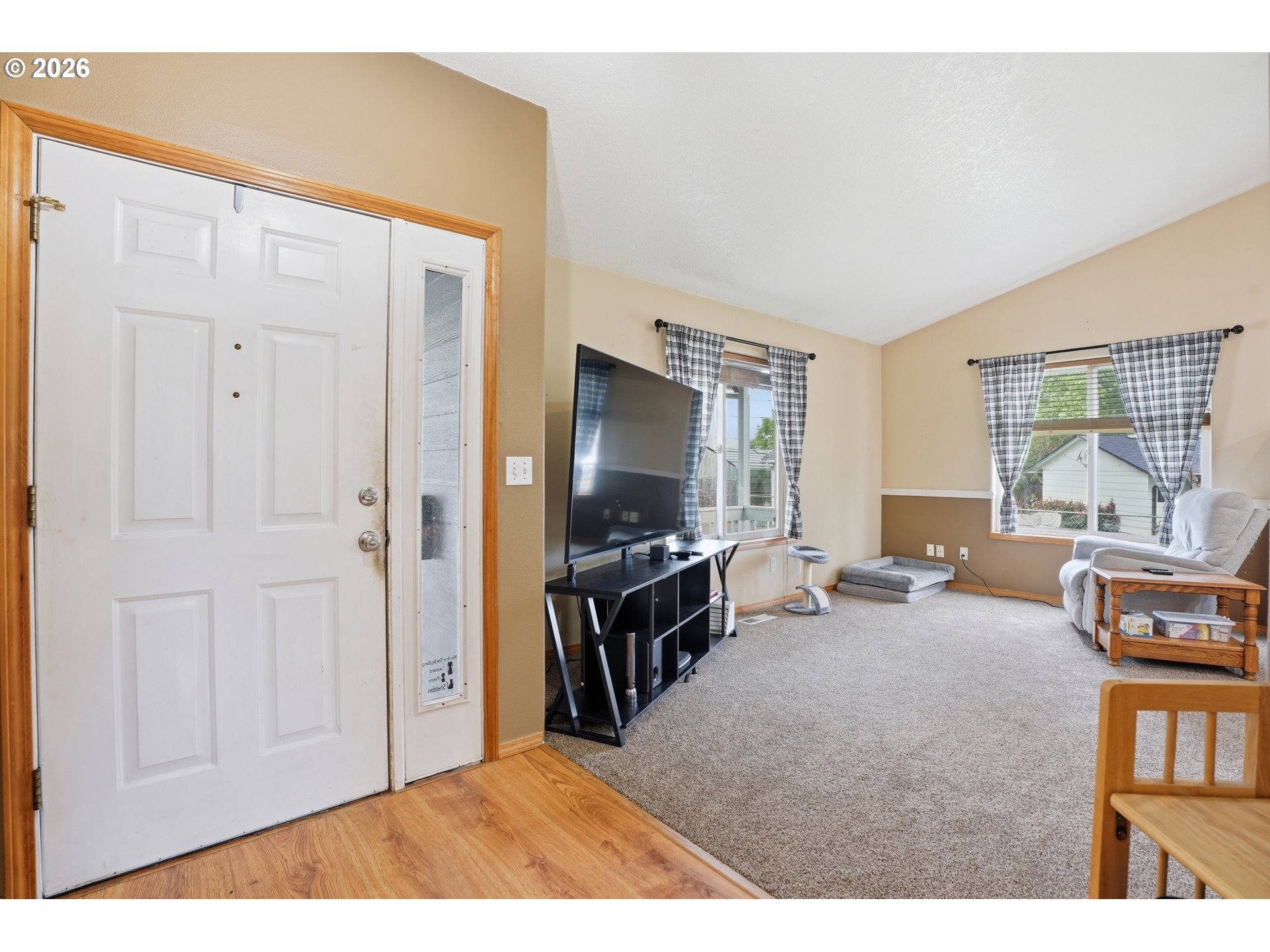 105 Toliver Road Molalla, OR 97038 - Photo 3 of 34 a living room with furniture and a flat screen tv