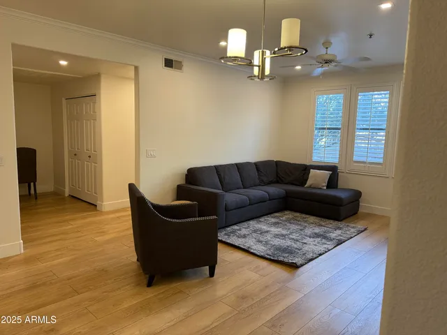 a living room with kitchen and a couch