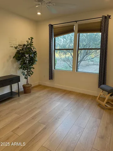 a view of room with window and hardwood floor
