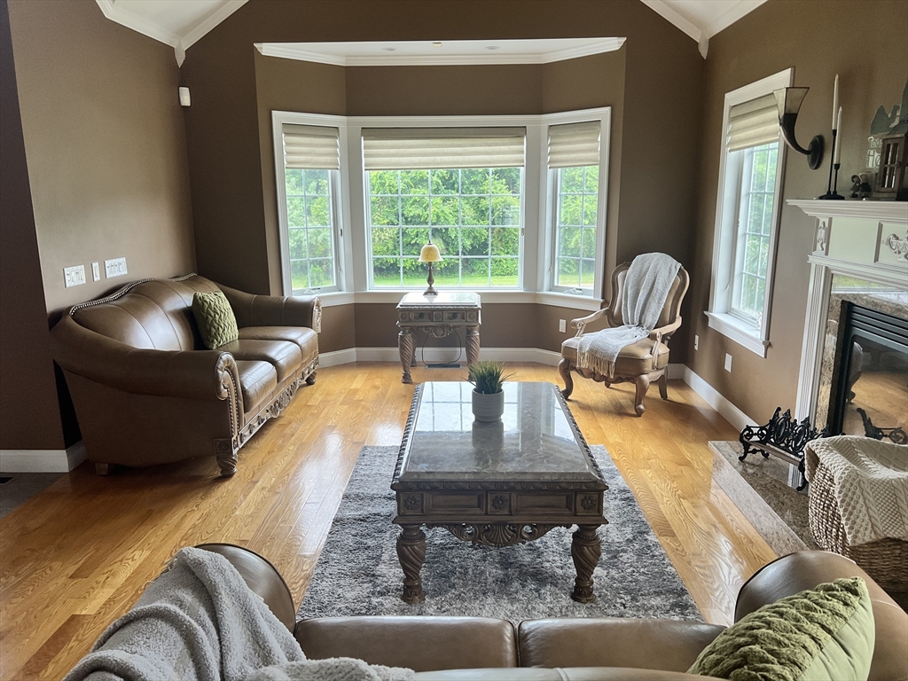 34 Base Lodge Road Swansea, MA 02777 - Photo 16 of 35 a living room with furniture fireplace and a large window