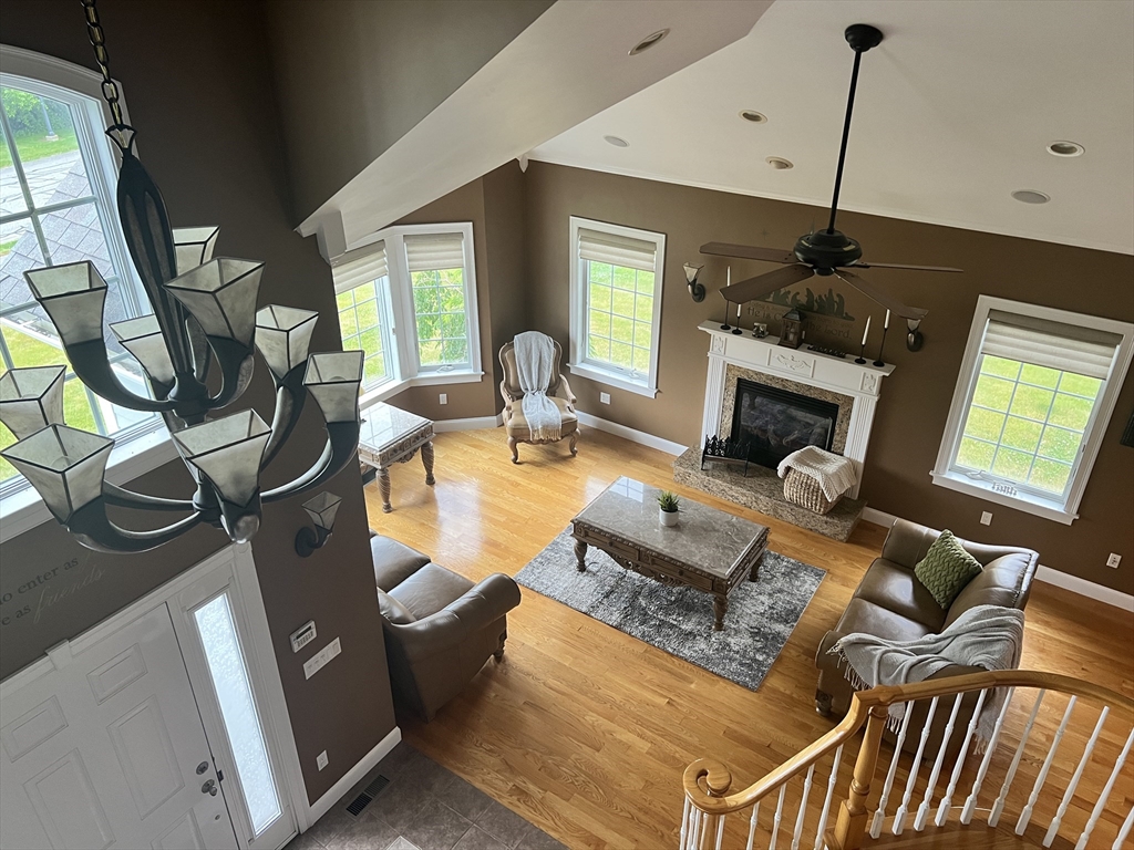 34 Base Lodge Road Swansea, MA 02777 - Photo 18 of 35 a living room with furniture a flat screen tv and a fireplace