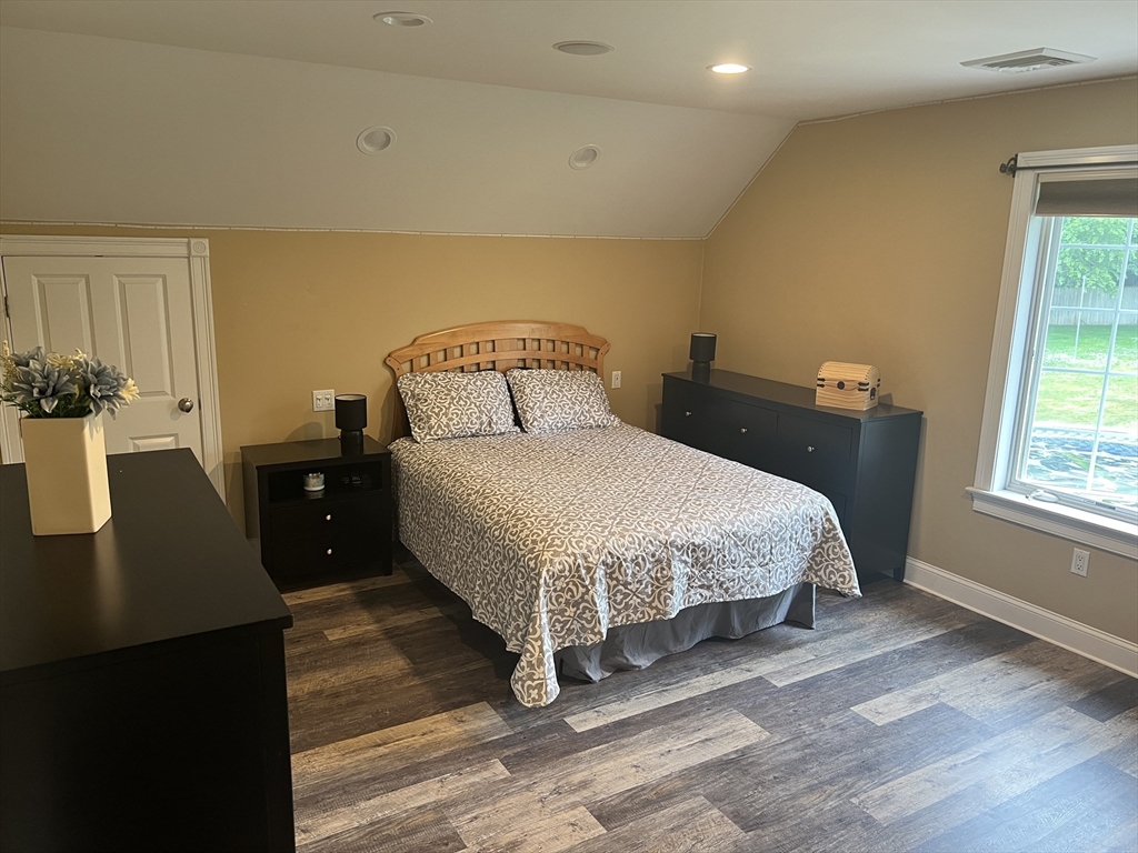 34 Base Lodge Road Swansea, MA 02777 - Photo 25 of 35 a bedroom with a bed and wooden floor