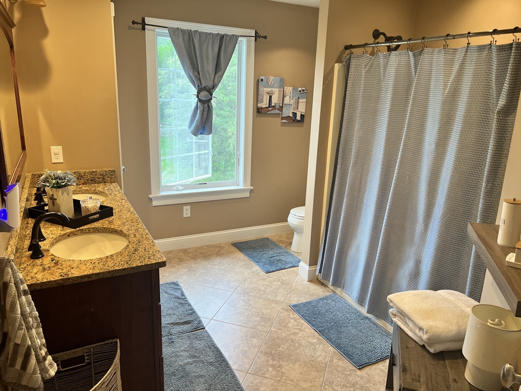 34 Base Lodge Road Swansea, MA 02777 - Photo 28 of 35 a bedroom with a bed and a window