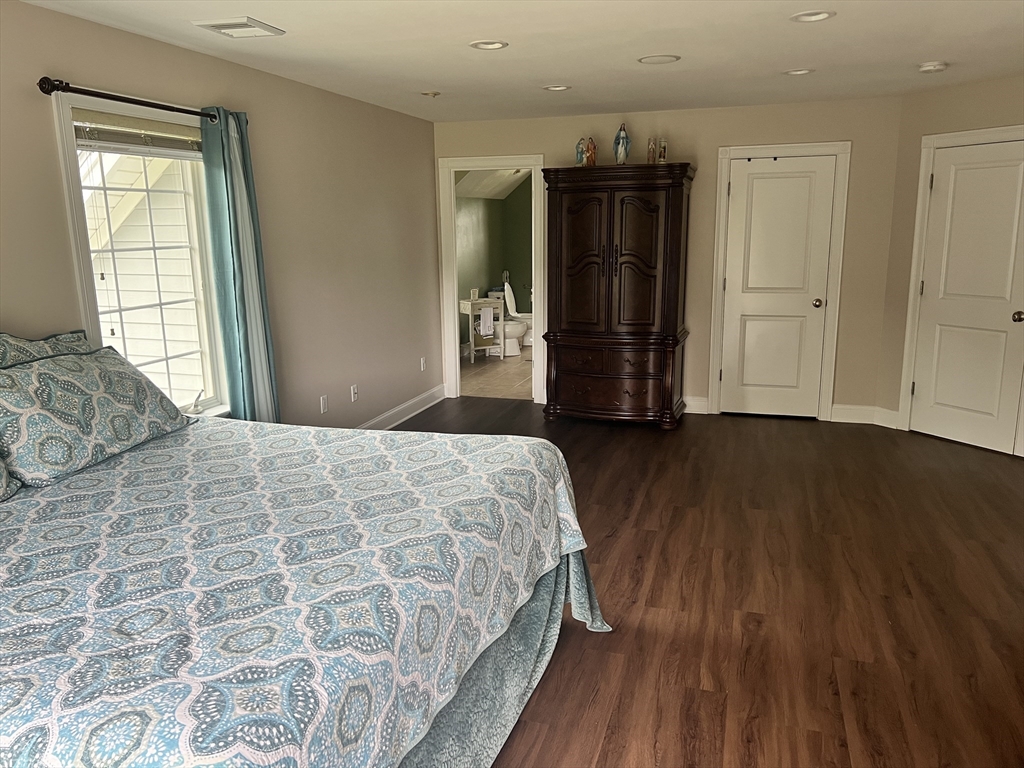 34 Base Lodge Road Swansea, MA 02777 - Photo 32 of 35 a bedroom with a bed and wooden floor