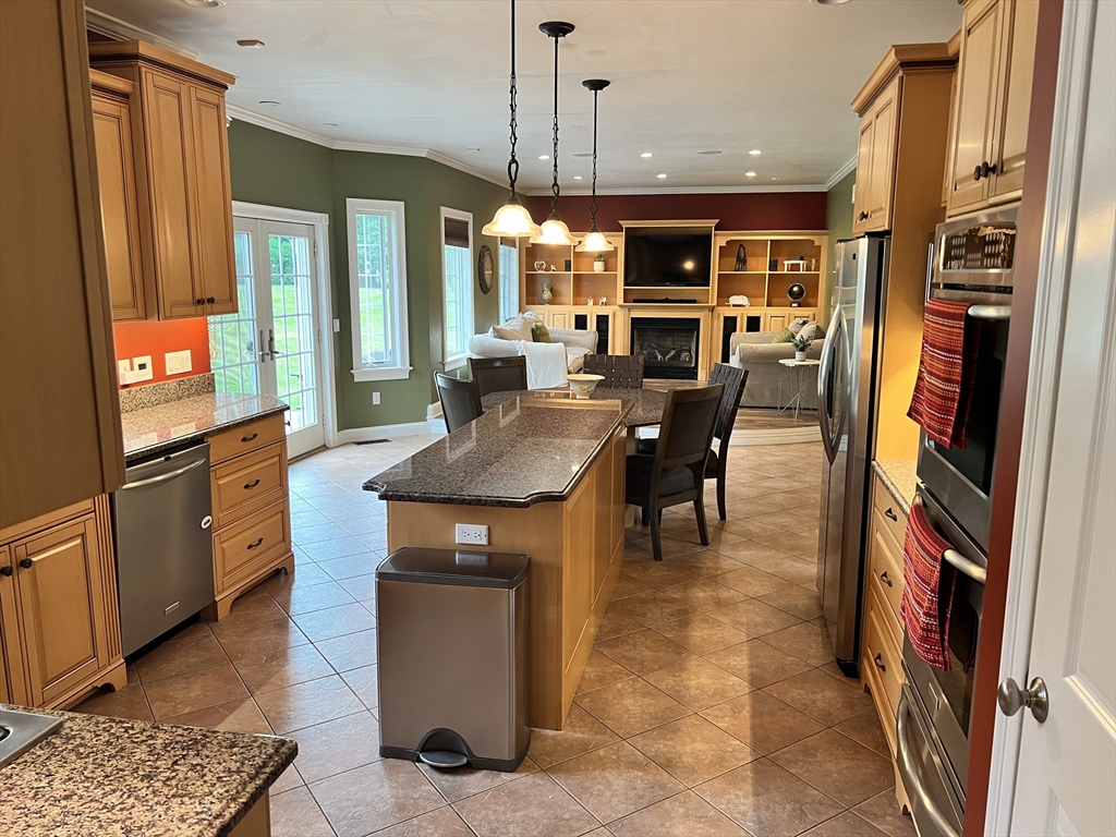 34 Base Lodge Road Swansea, MA 02777 - Photo 6 of 35 a kitchen with stainless steel appliances granite countertop a refrigerator a stove and a sink