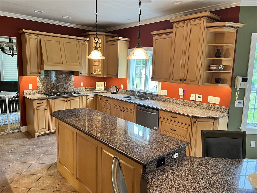 34 Base Lodge Road Swansea, MA 02777 - Photo 7 of 35 a kitchen with stainless steel appliances granite countertop a sink a stove and a microwave