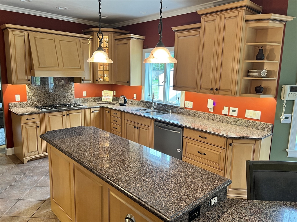 34 Base Lodge Road Swansea, MA 02777 - Photo 10 of 35 a kitchen with kitchen island granite countertop a sink window and cabinets