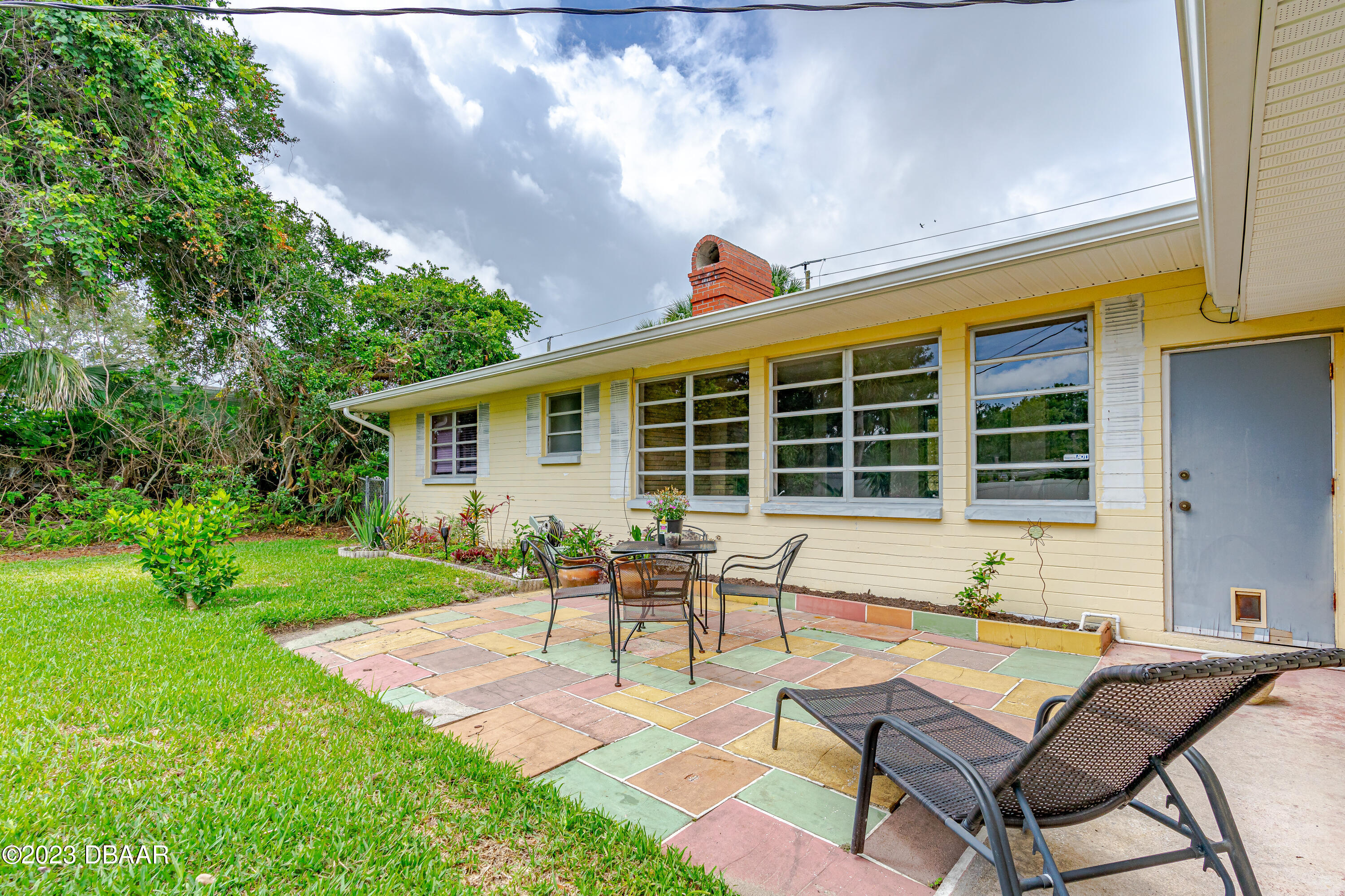 267 South Halifax Drive Ormond Beach, FL 32176 - Photo 11 of 47 a house view with a sitting space and garden