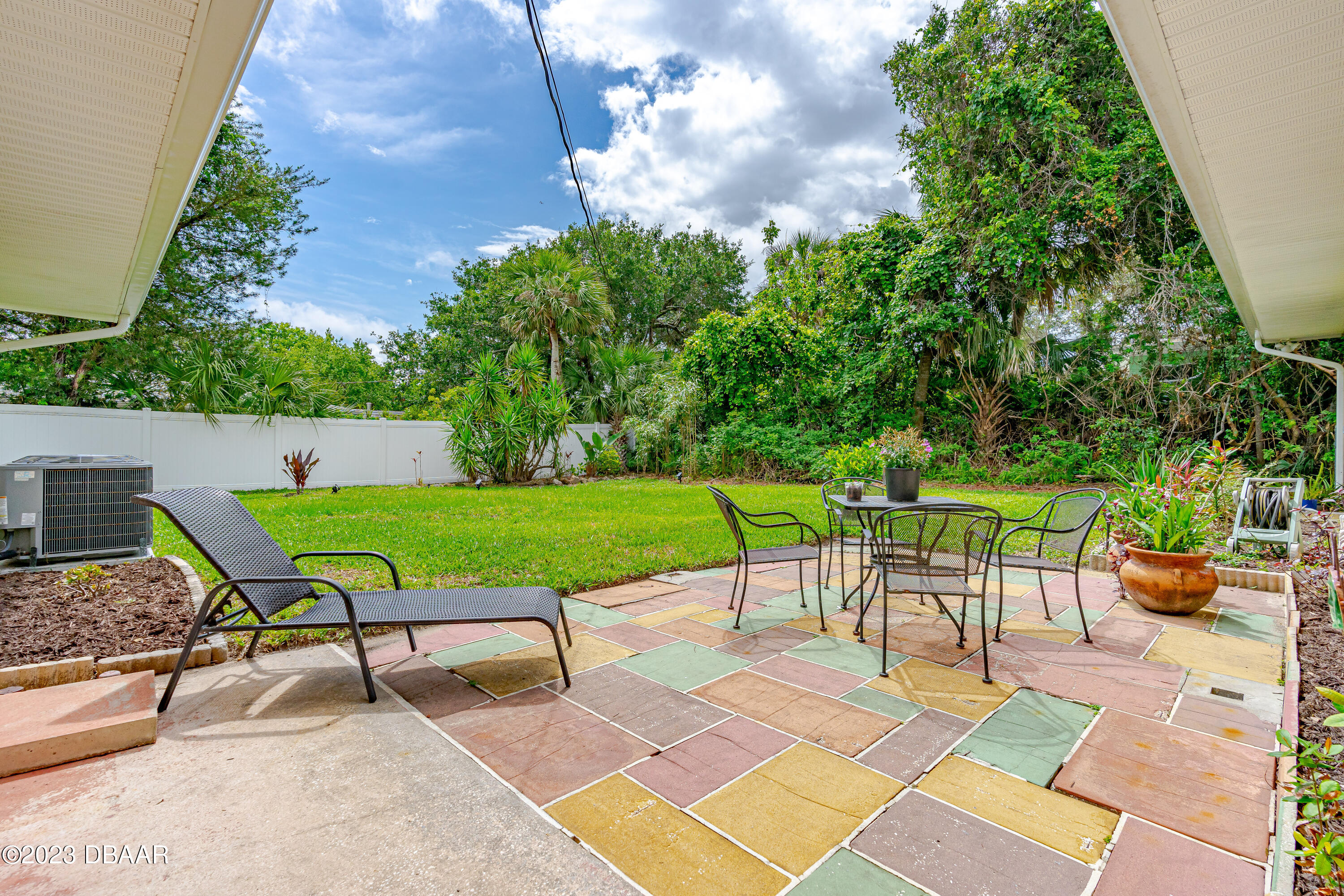 267 South Halifax Drive Ormond Beach, FL 32176 - Photo 12 of 47 a view of a backyard with sitting area