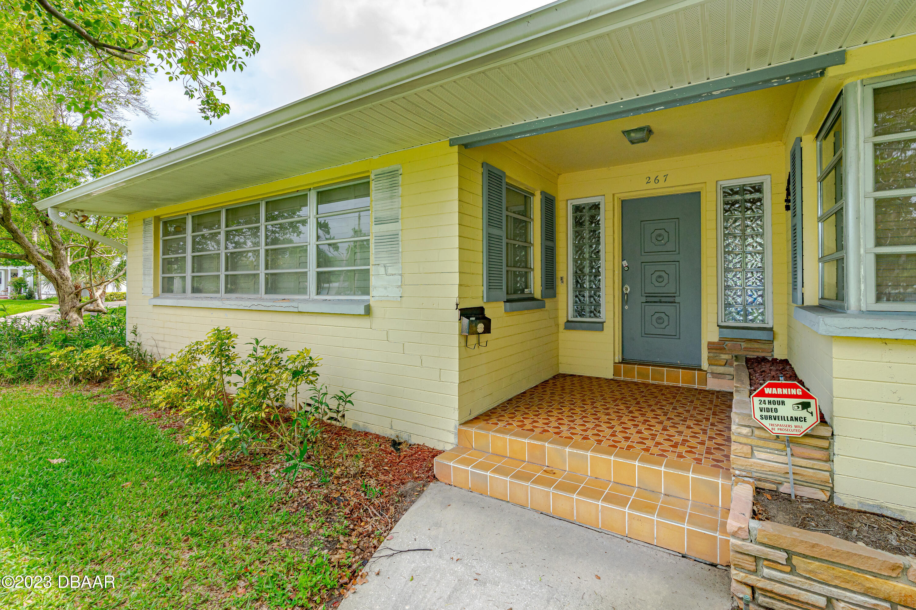 267 South Halifax Drive Ormond Beach, FL 32176 - Photo 13 of 47 a front view of a house with a yard