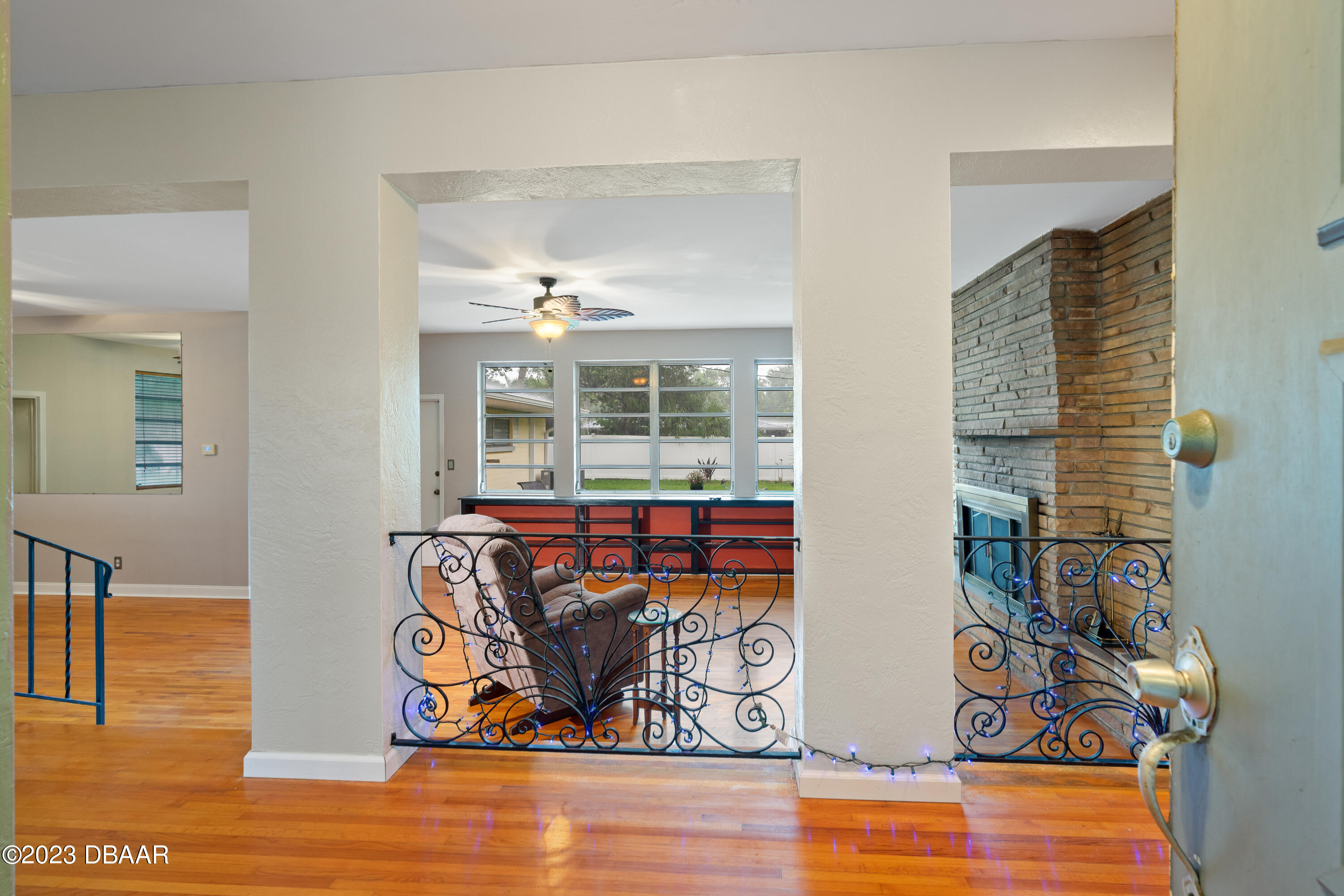 267 South Halifax Drive Ormond Beach, FL 32176 - Photo 14 of 47 a view of living room filled with furniture and wooden floor