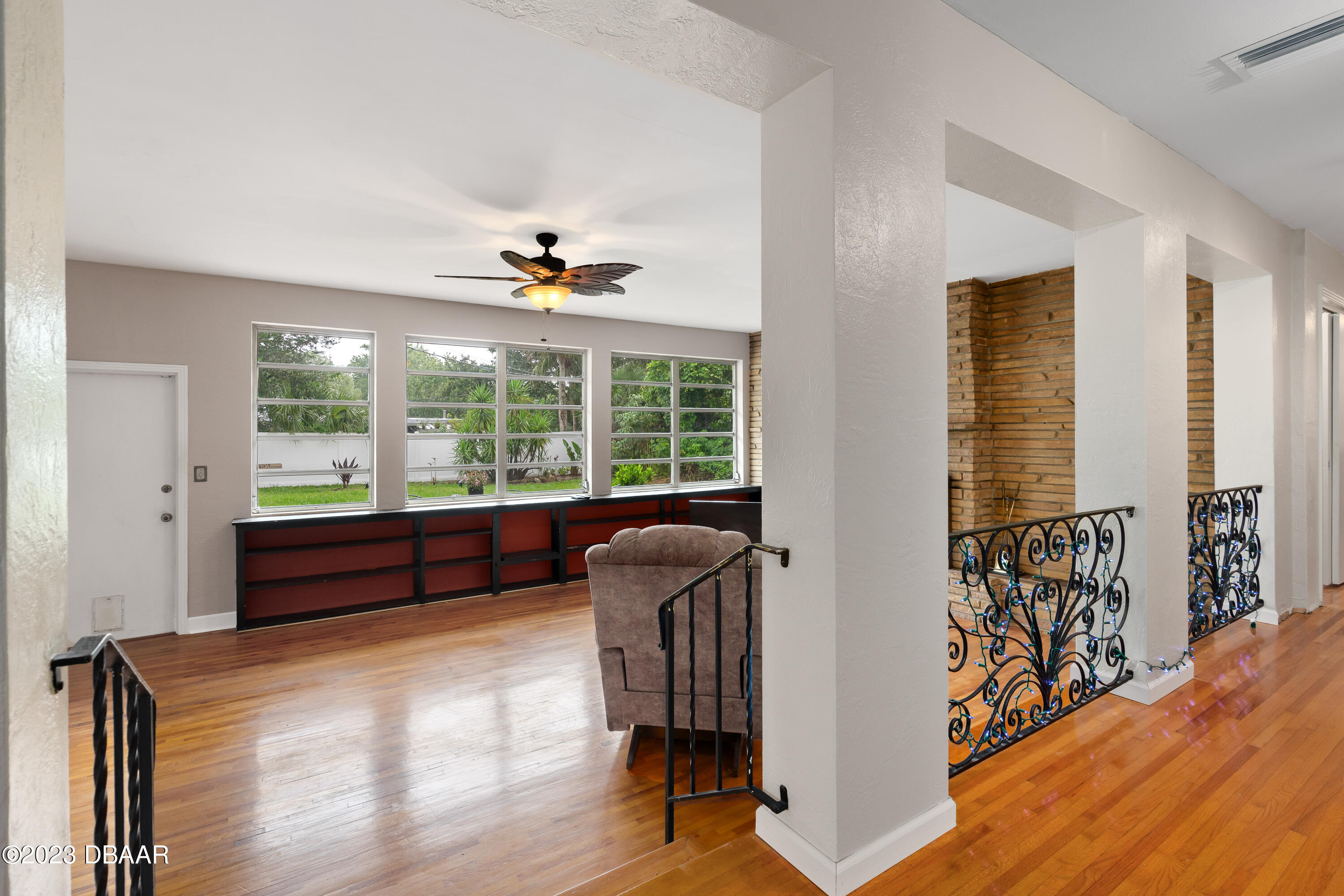 267 South Halifax Drive Ormond Beach, FL 32176 - Photo 15 of 47 a view of an entryway with wooden floor and windows