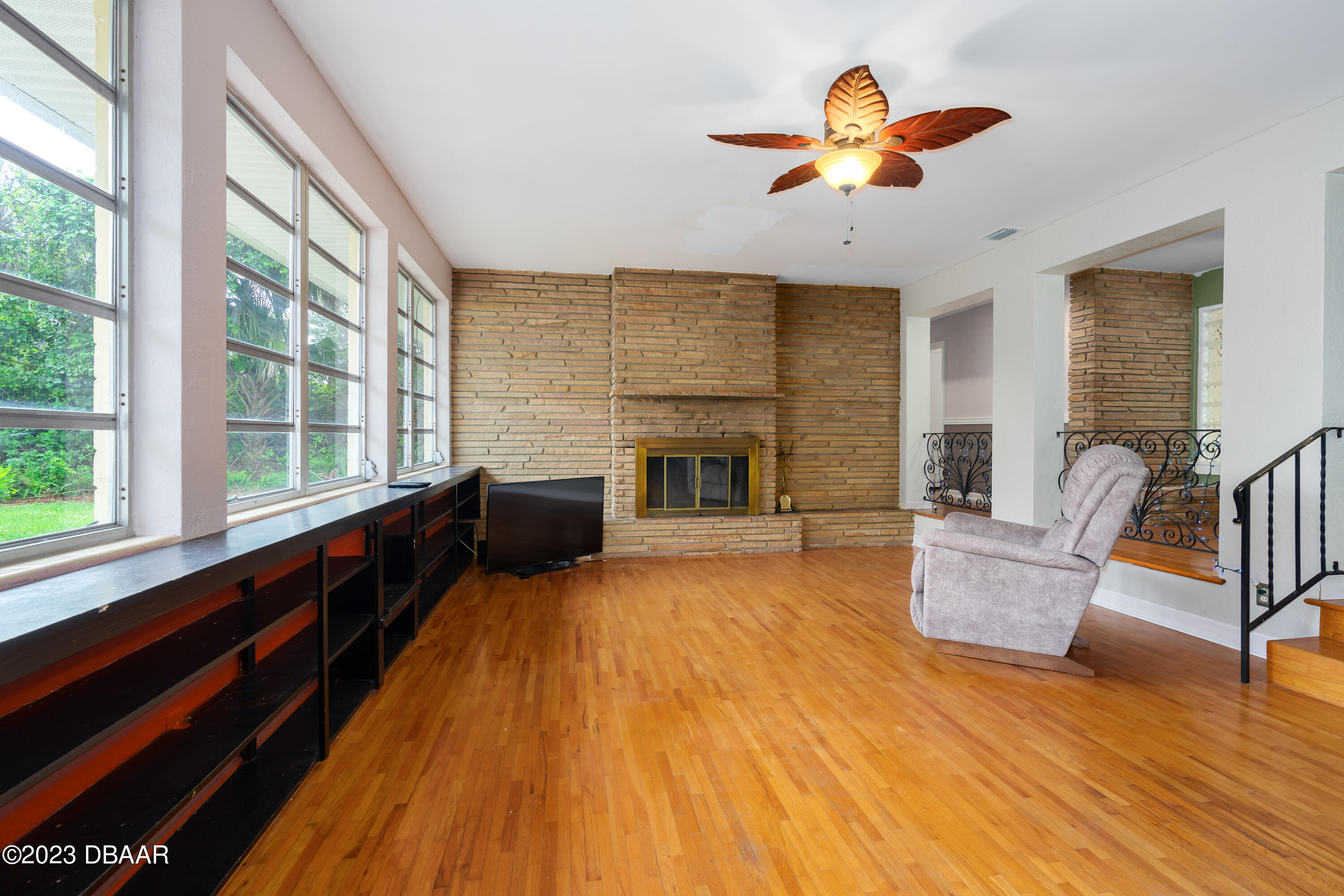 267 South Halifax Drive Ormond Beach, FL 32176 - Photo 16 of 47 a living room with furniture and a fireplace