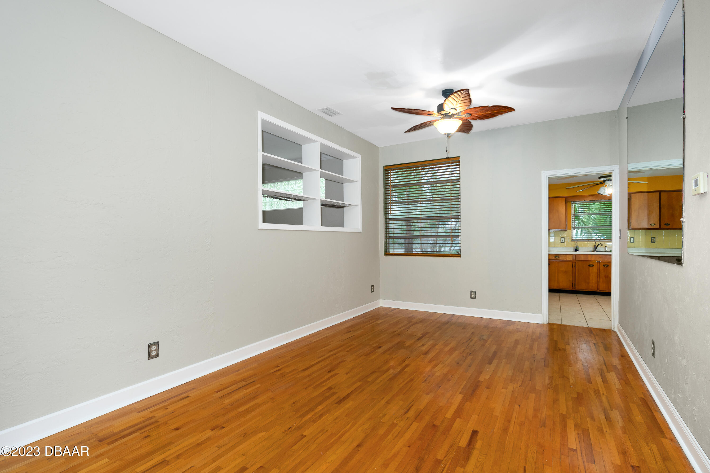 267 South Halifax Drive Ormond Beach, FL 32176 - Photo 21 of 47 wooden floor in an empty room with a window