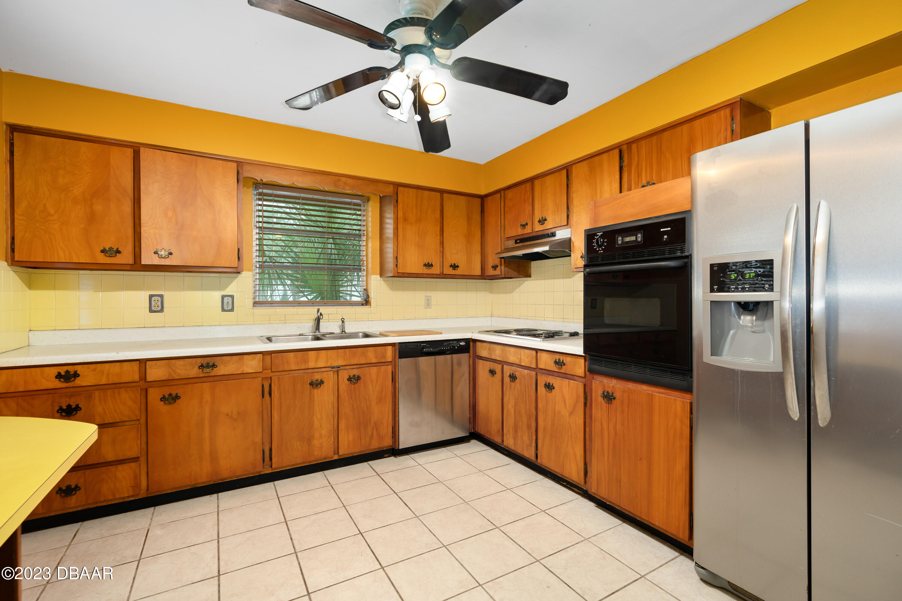 267 South Halifax Drive Ormond Beach, FL 32176 - Photo 22 of 47 a kitchen with stainless steel appliances granite countertop a sink and cabinets