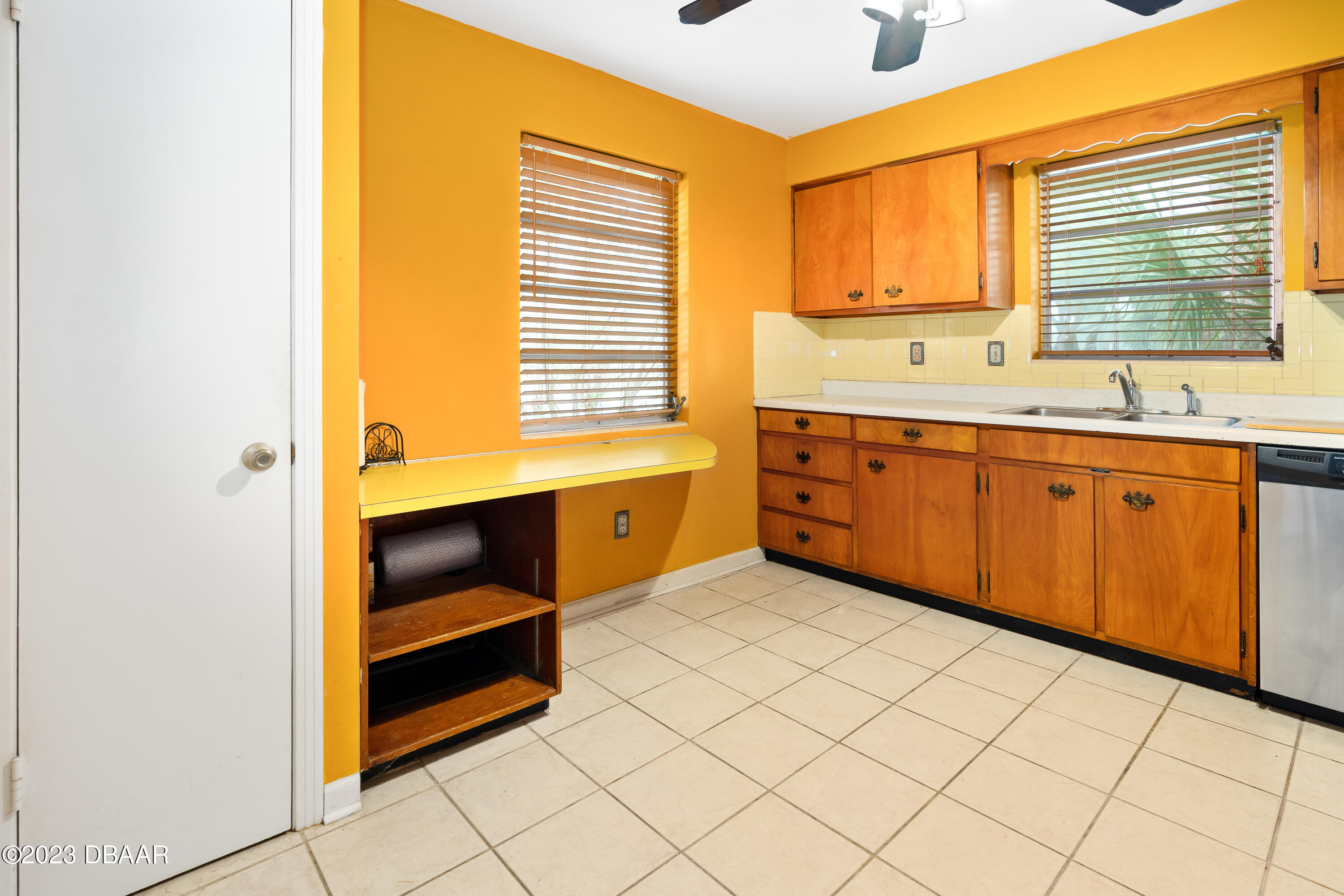 267 South Halifax Drive Ormond Beach, FL 32176 - Photo 23 of 47 a kitchen with granite countertop a sink and cabinets