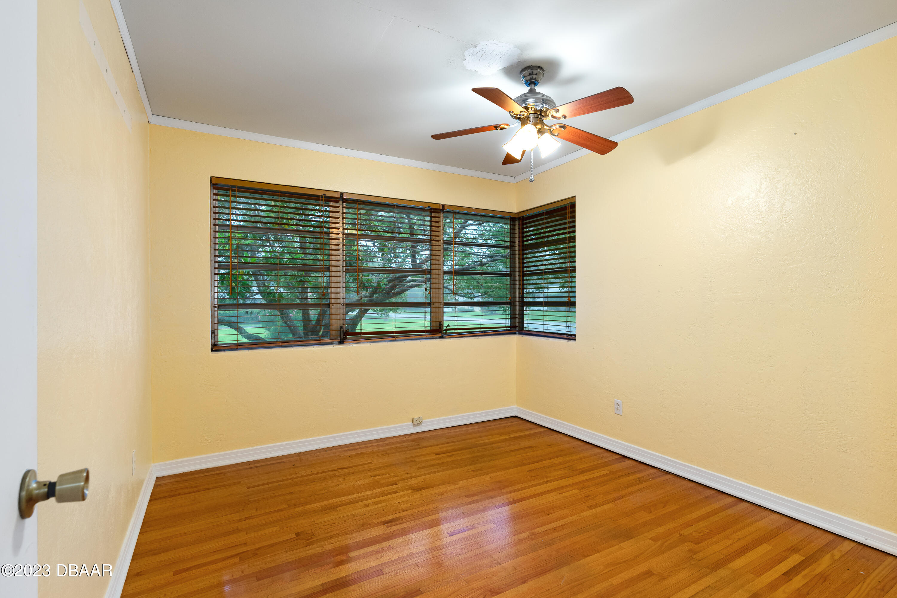 267 South Halifax Drive Ormond Beach, FL 32176 - Photo 28 of 47 a view of a room with wooden floor fan and a window