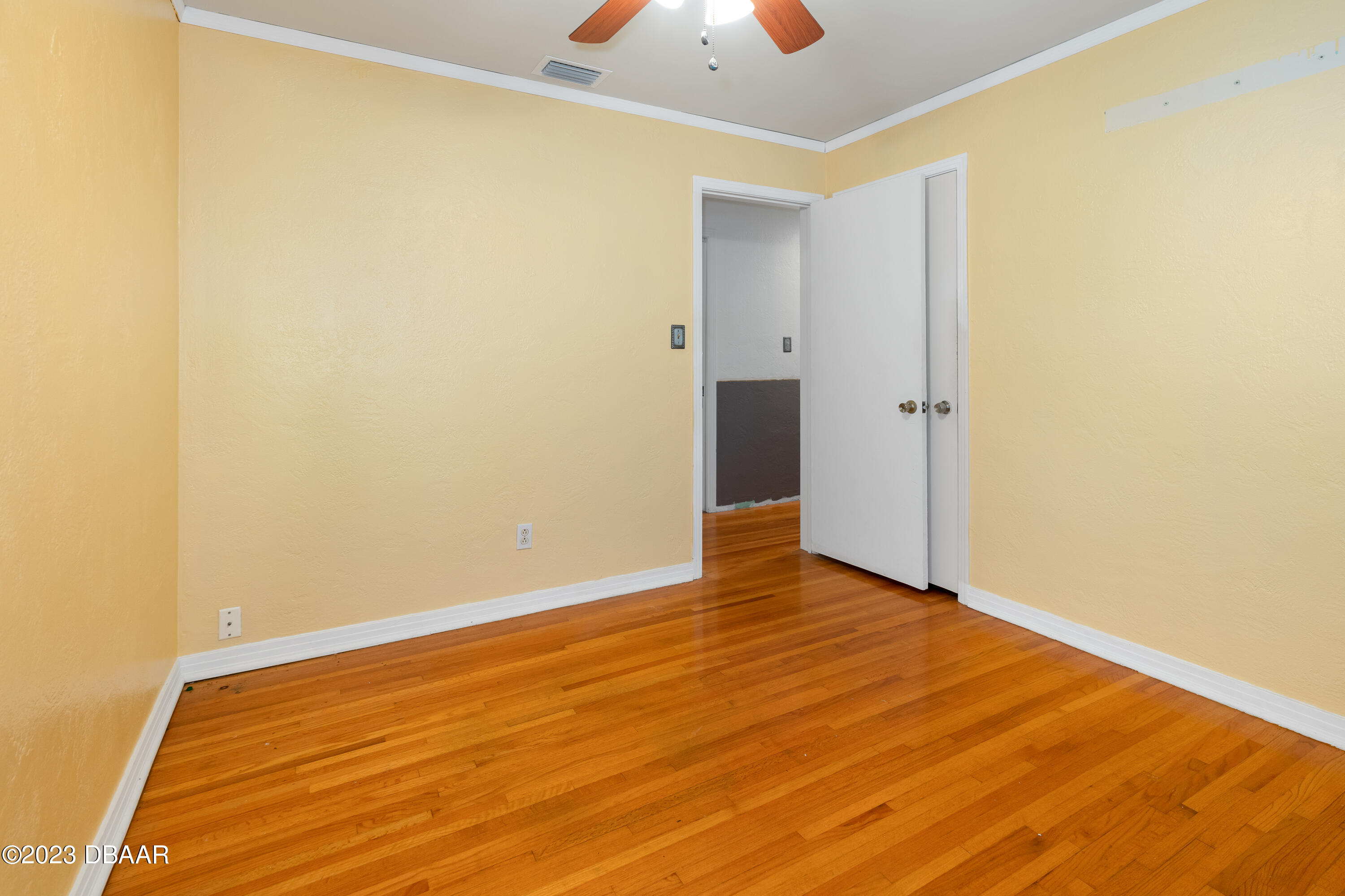 267 South Halifax Drive Ormond Beach, FL 32176 - Photo 29 of 47 a view of an empty room with wooden floor