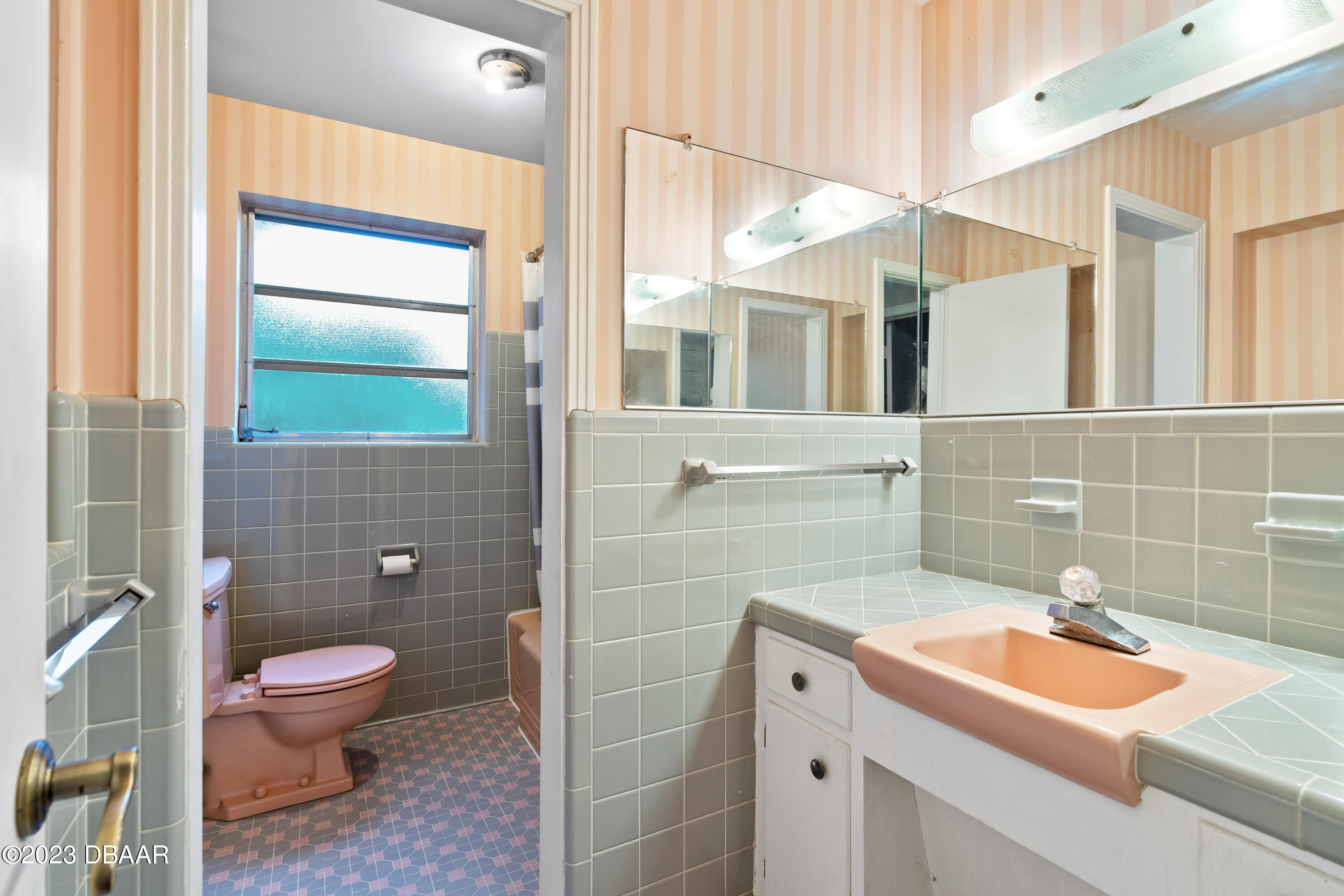 267 South Halifax Drive Ormond Beach, FL 32176 - Photo 32 of 47 a bathroom with a sink a toilet and shower