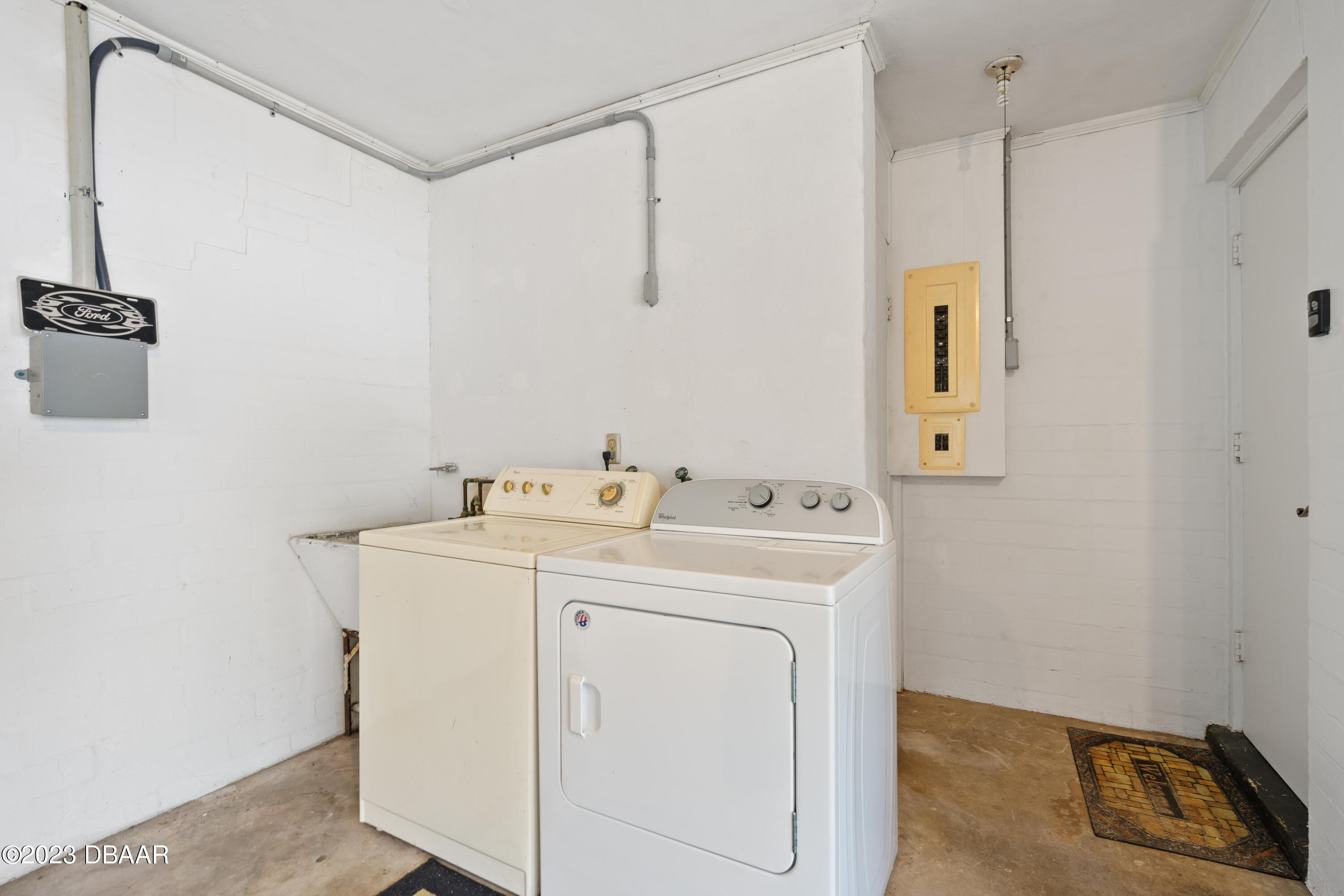 267 South Halifax Drive Ormond Beach, FL 32176 - Photo 35 of 47 a utility room with dryer and washer
