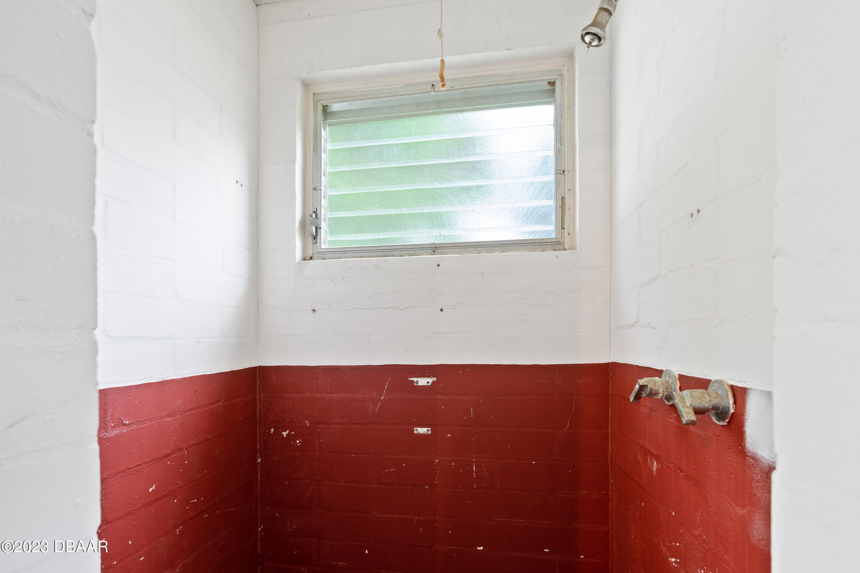 267 South Halifax Drive Ormond Beach, FL 32176 - Photo 36 of 47 a view of an empty room with a window