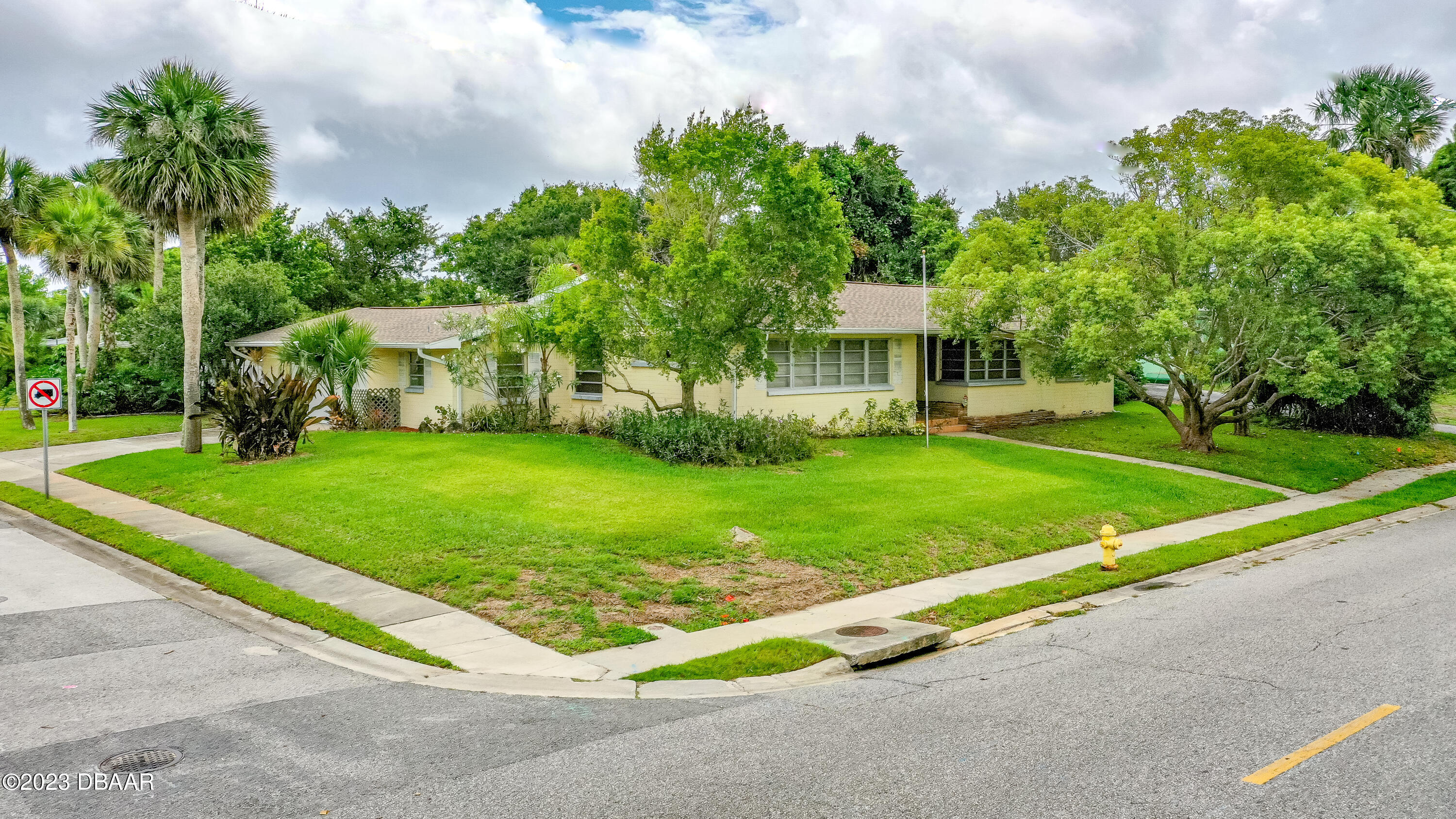 267 South Halifax Drive Ormond Beach, FL 32176 - Photo 38 of 47 a view of a house with a big yard plants and large trees