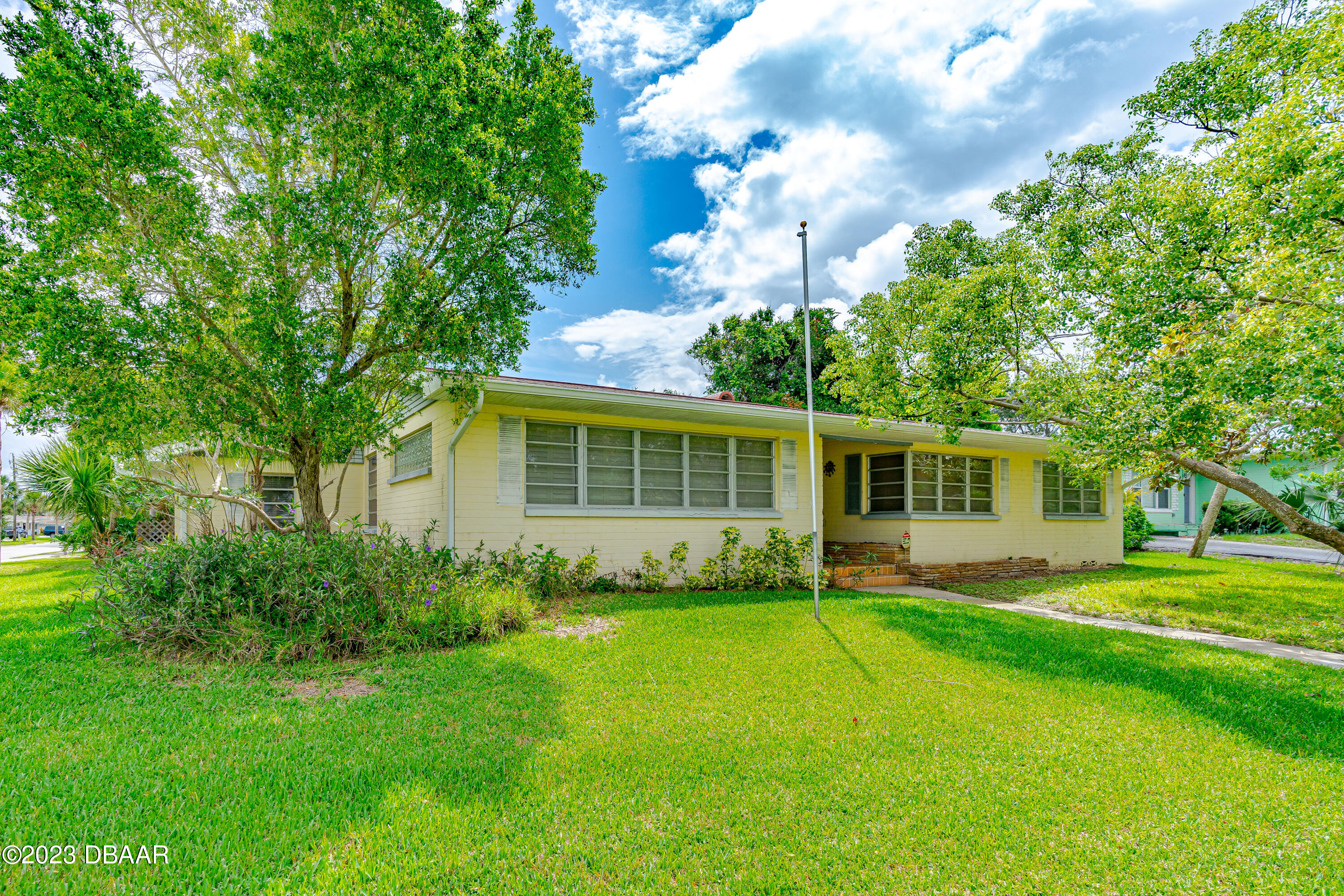 267 South Halifax Drive Ormond Beach, FL 32176 - Photo 4 of 47 a view of a house with a yard