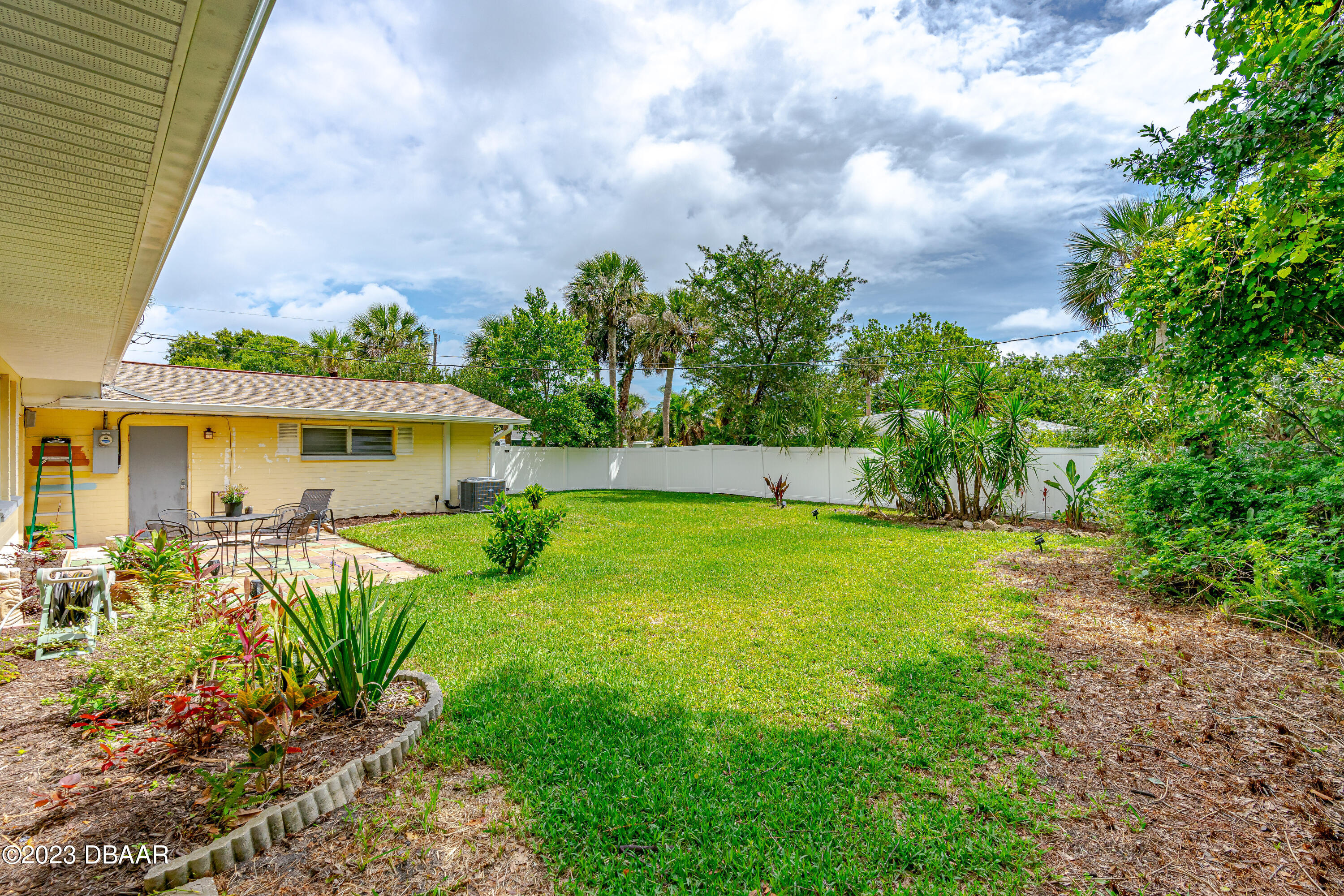 267 South Halifax Drive Ormond Beach, FL 32176 - Photo 8 of 47 a view of backyard of house with green space
