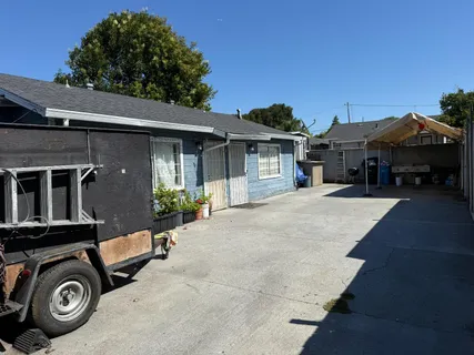 a view of a car park in front of house