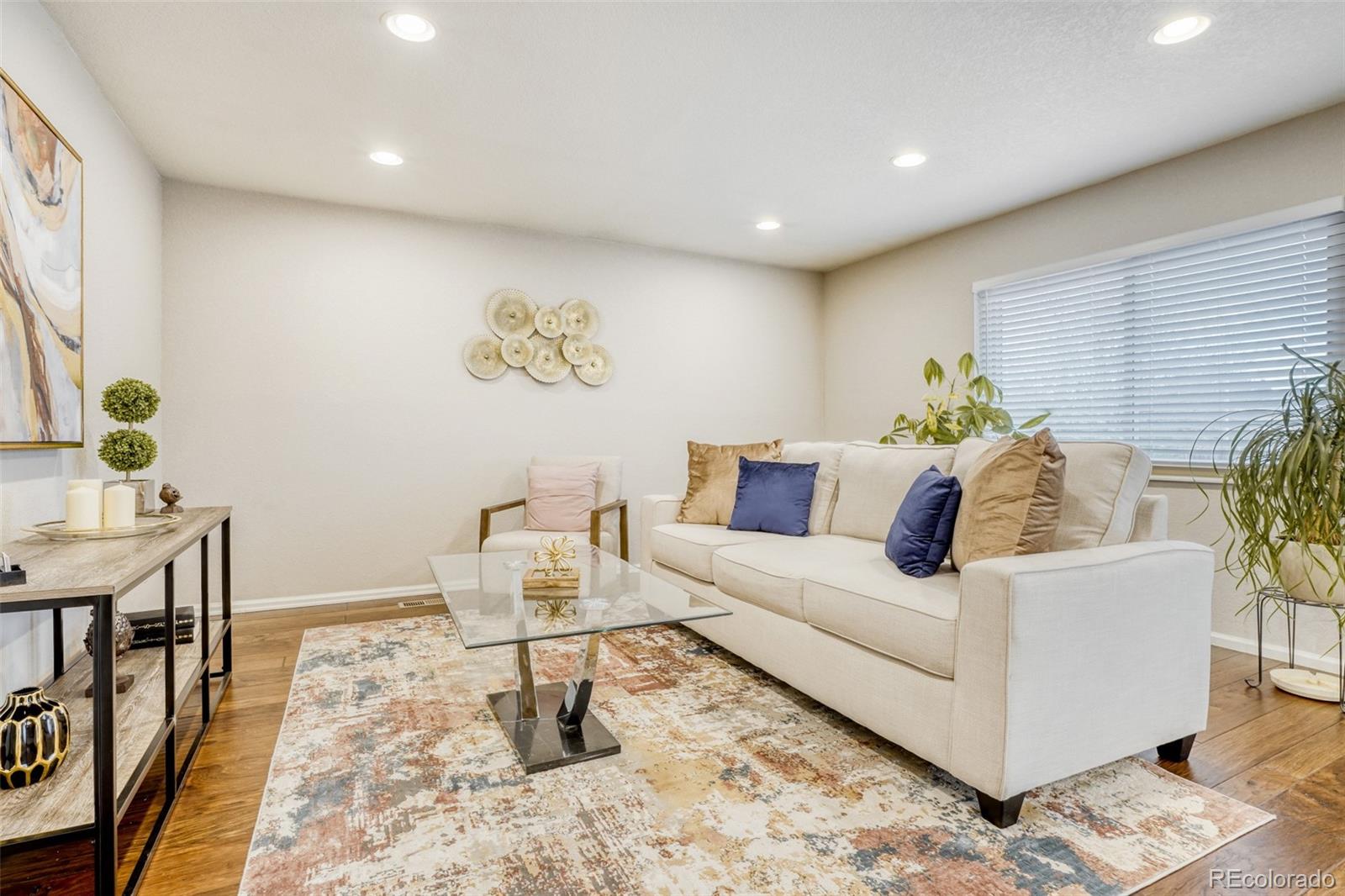 2682 South Quintero Way Aurora, CO 80013 - Photo 11 of 25 a living room with furniture and wooden floor