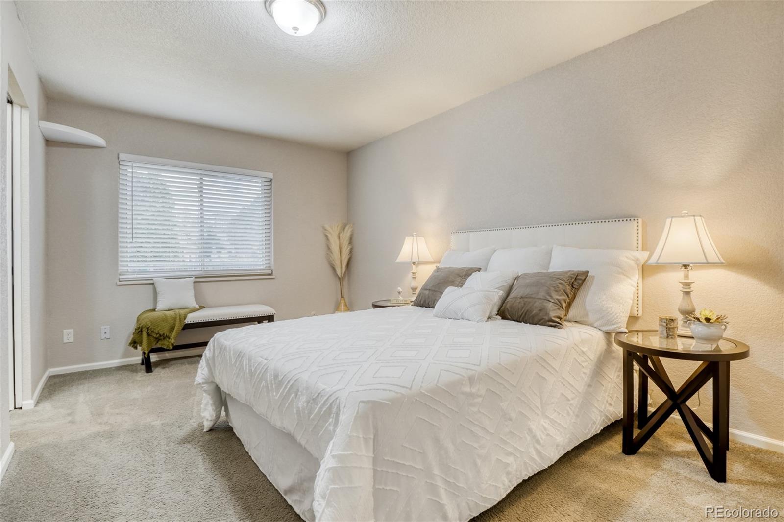 2682 South Quintero Way Aurora, CO 80013 - Photo 12 of 25 a bedroom with a bed and a window