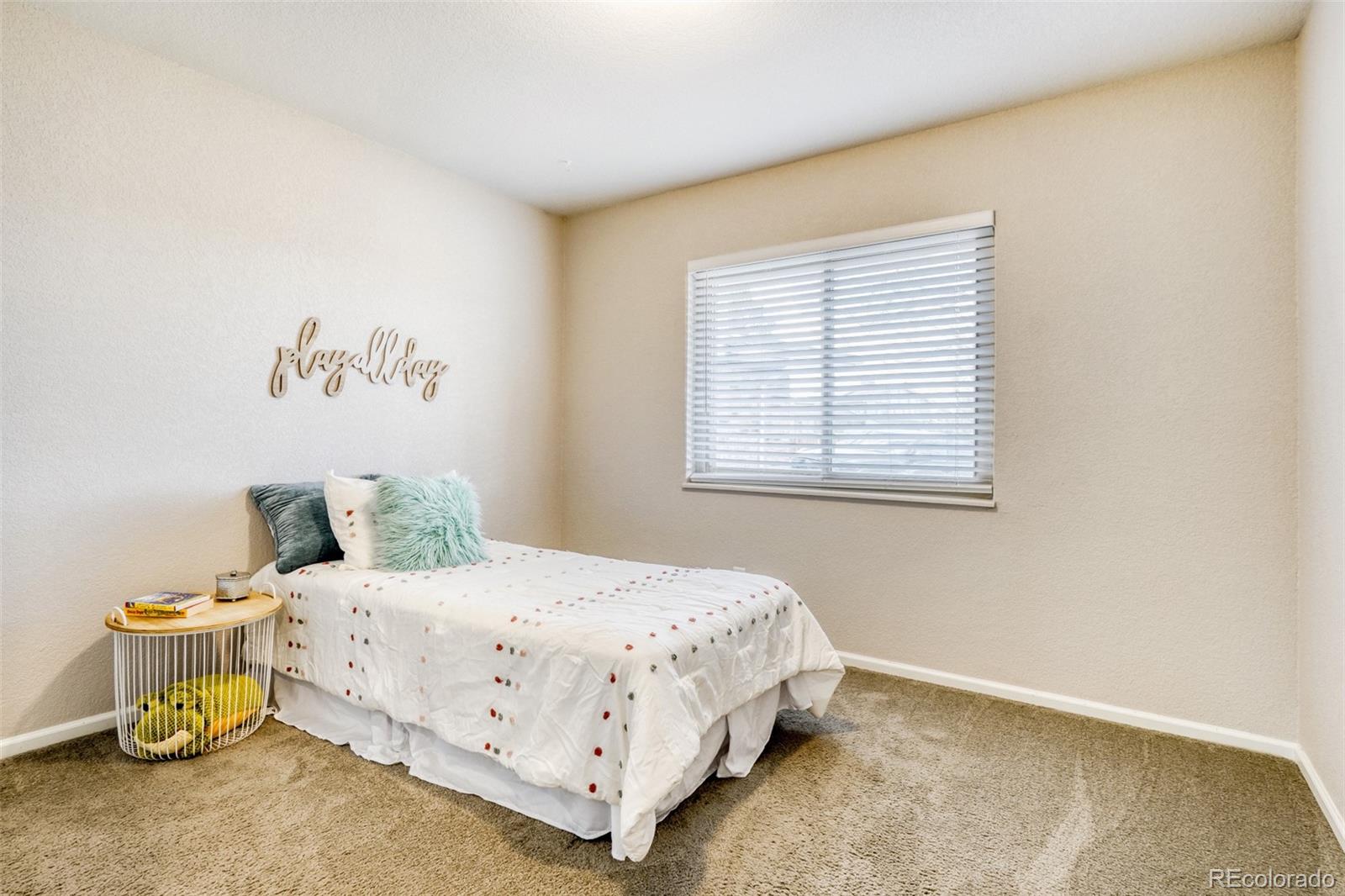 2682 South Quintero Way Aurora, CO 80013 - Photo 15 of 25 a bedroom with a bed and window