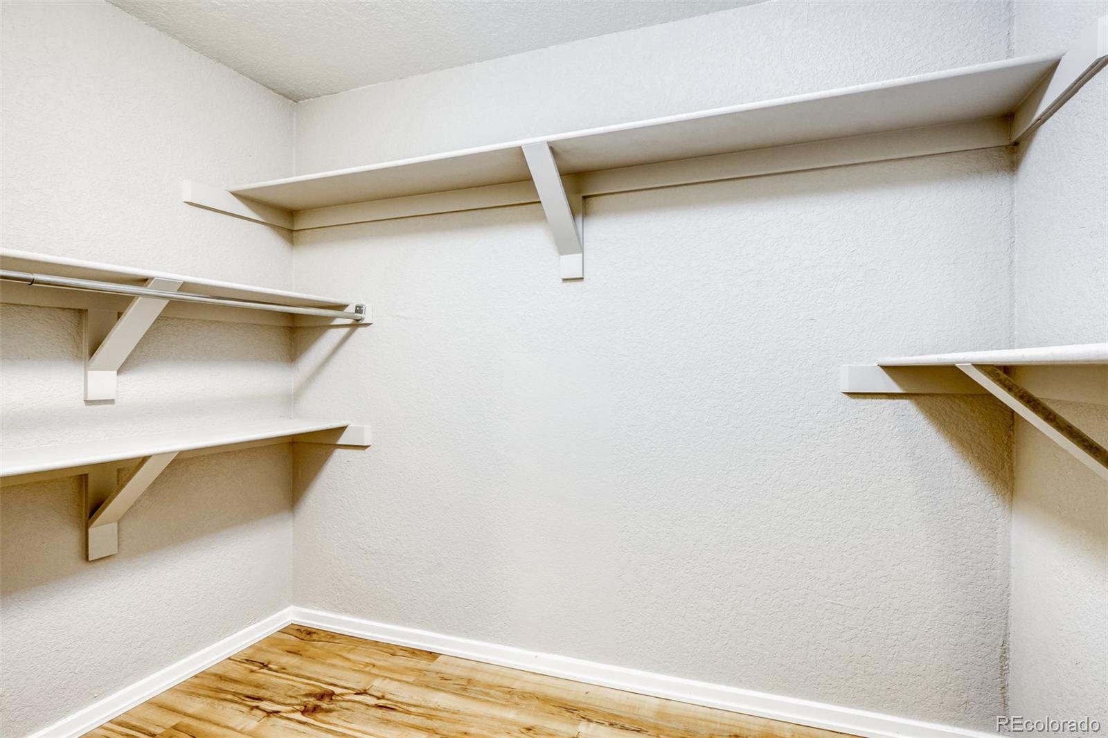 2682 South Quintero Way Aurora, CO 80013 - Photo 19 of 25 a view of walk in closet