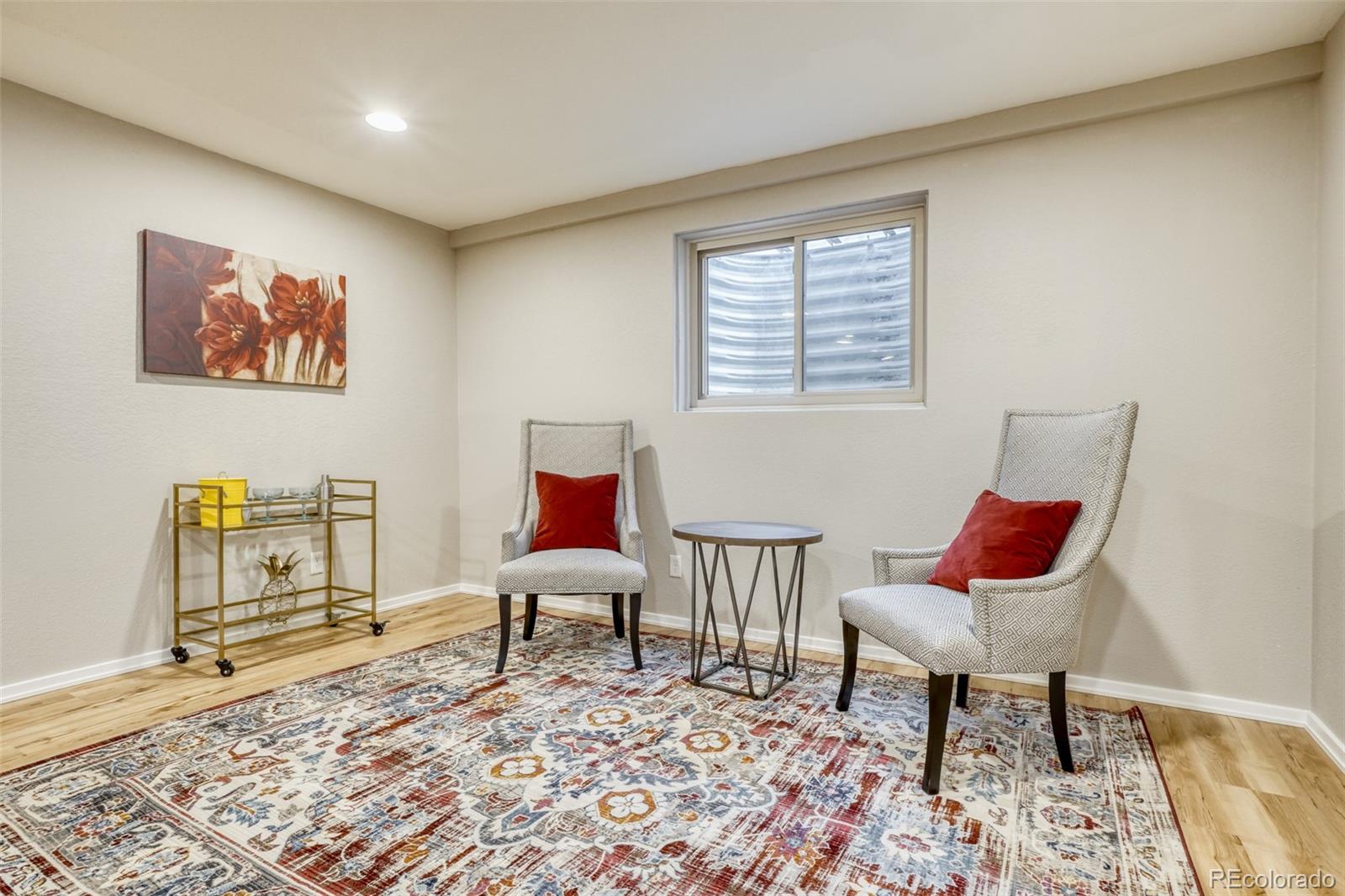 2682 South Quintero Way Aurora, CO 80013 - Photo 22 of 25 a living room with furniture and a rug
