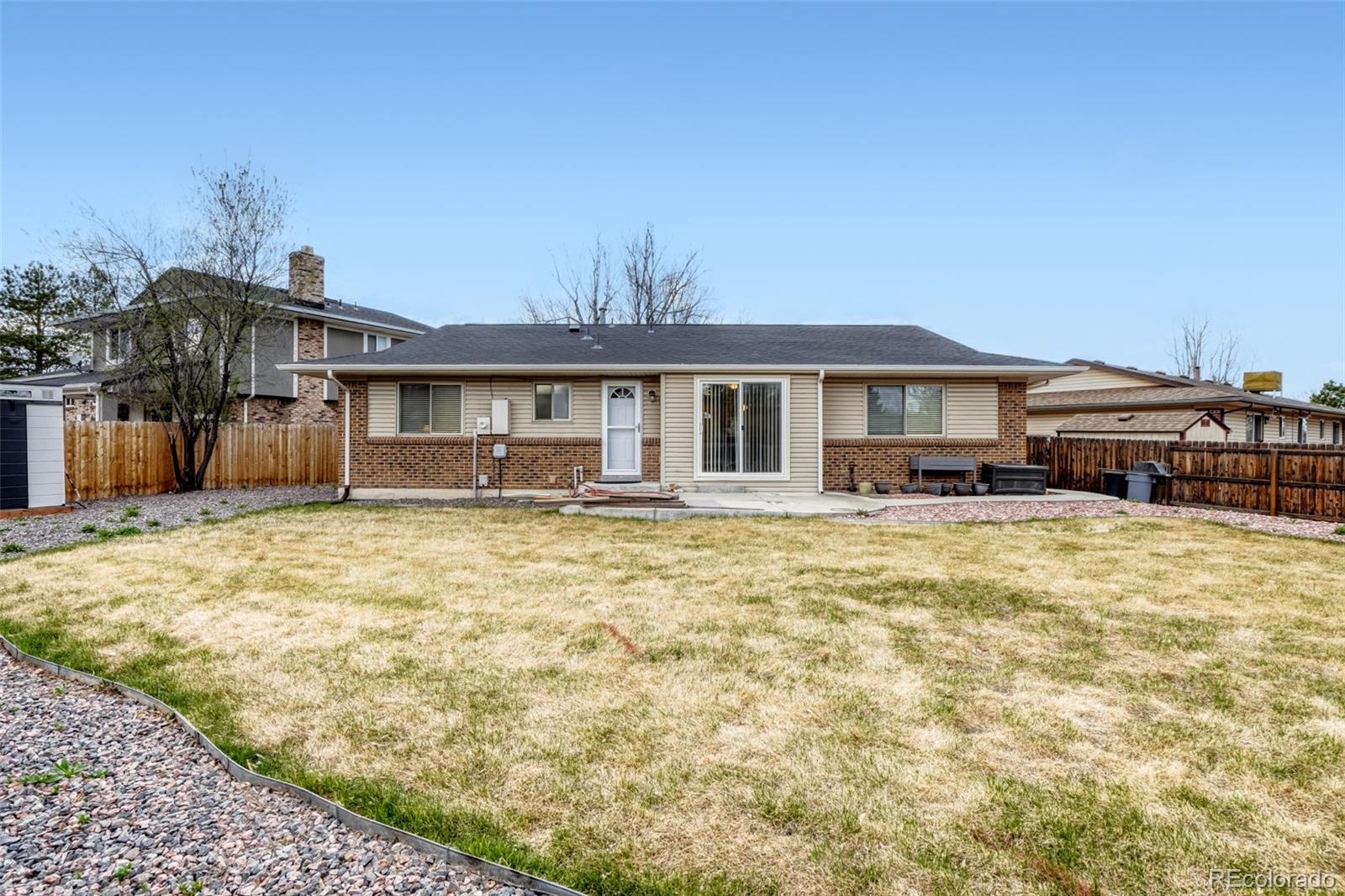 2682 South Quintero Way Aurora, CO 80013 - Photo 25 of 25 a front view of a house with a yard