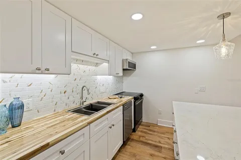a kitchen with a sink and cabinets